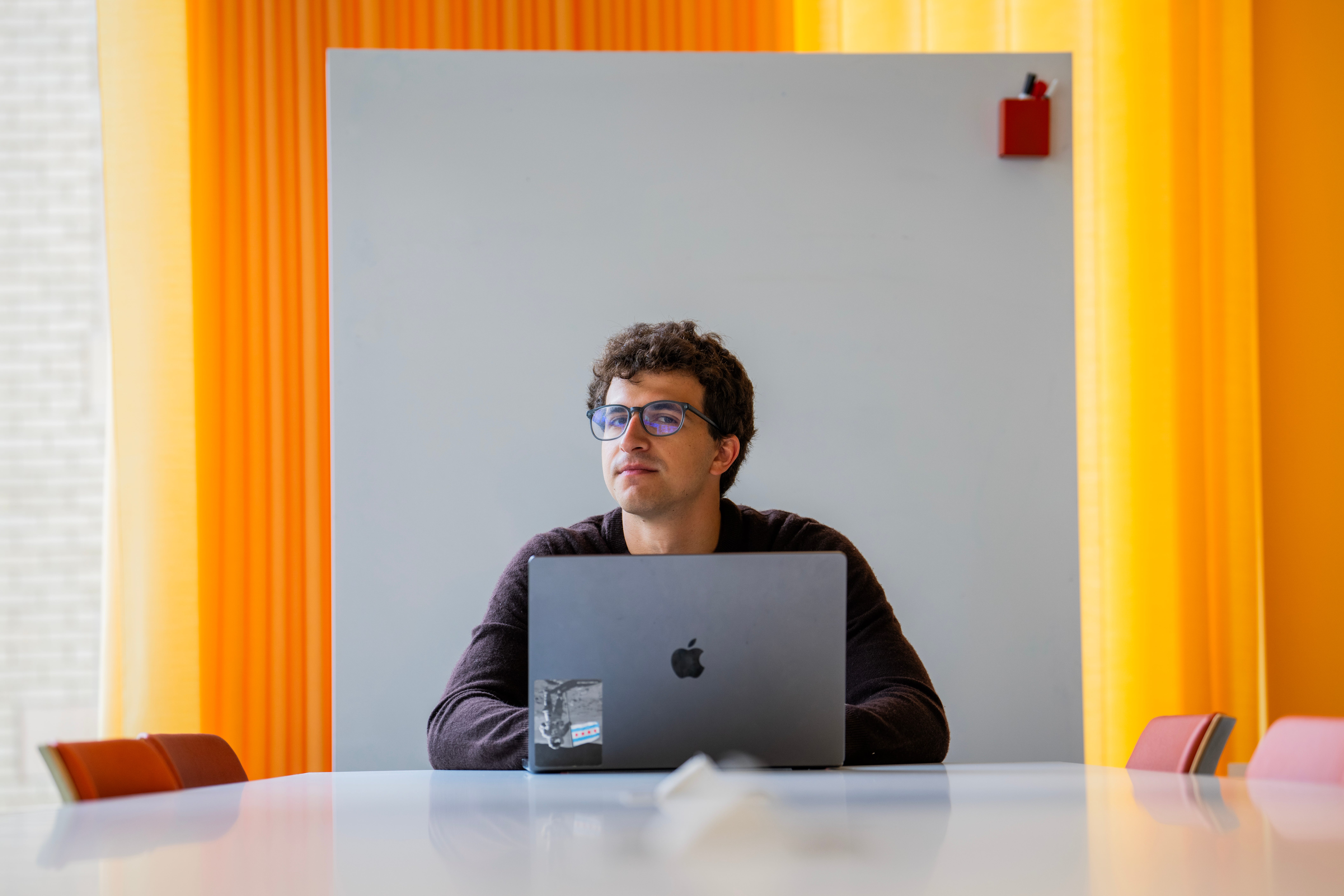 Alex Schapiro is sitting in front of his laptop