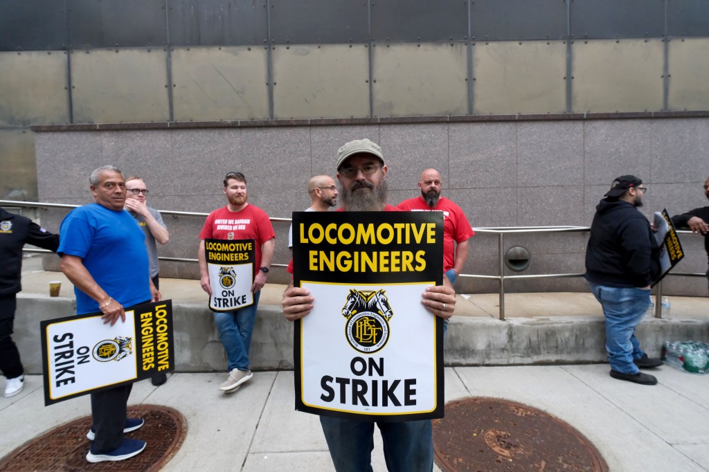 Transit engineer Joe Varela, along with a handful of colleagues, is seen on the picket line outside NJ Transit offices near Newark Penn Station early Friday, May 16, 2025.