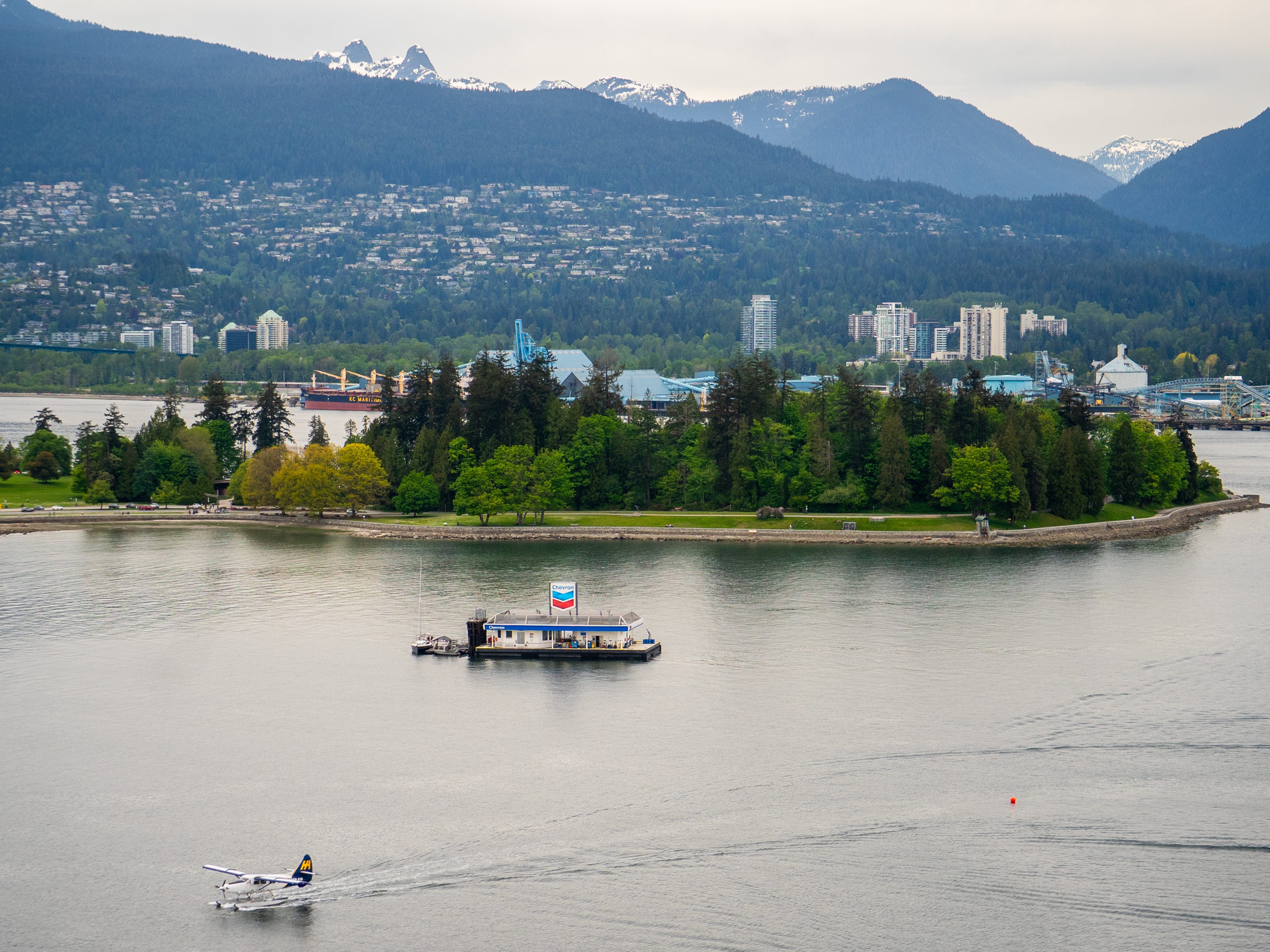 A floating gas station in the water in front of the city of Vancouver