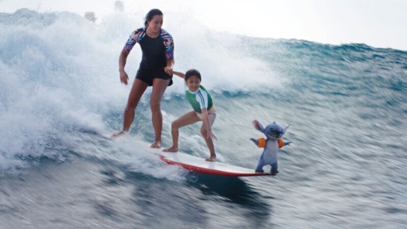 Sydney Agudong, Maia Kealoha, and Stitch in Disney’s live-action Lilo & Stitch.