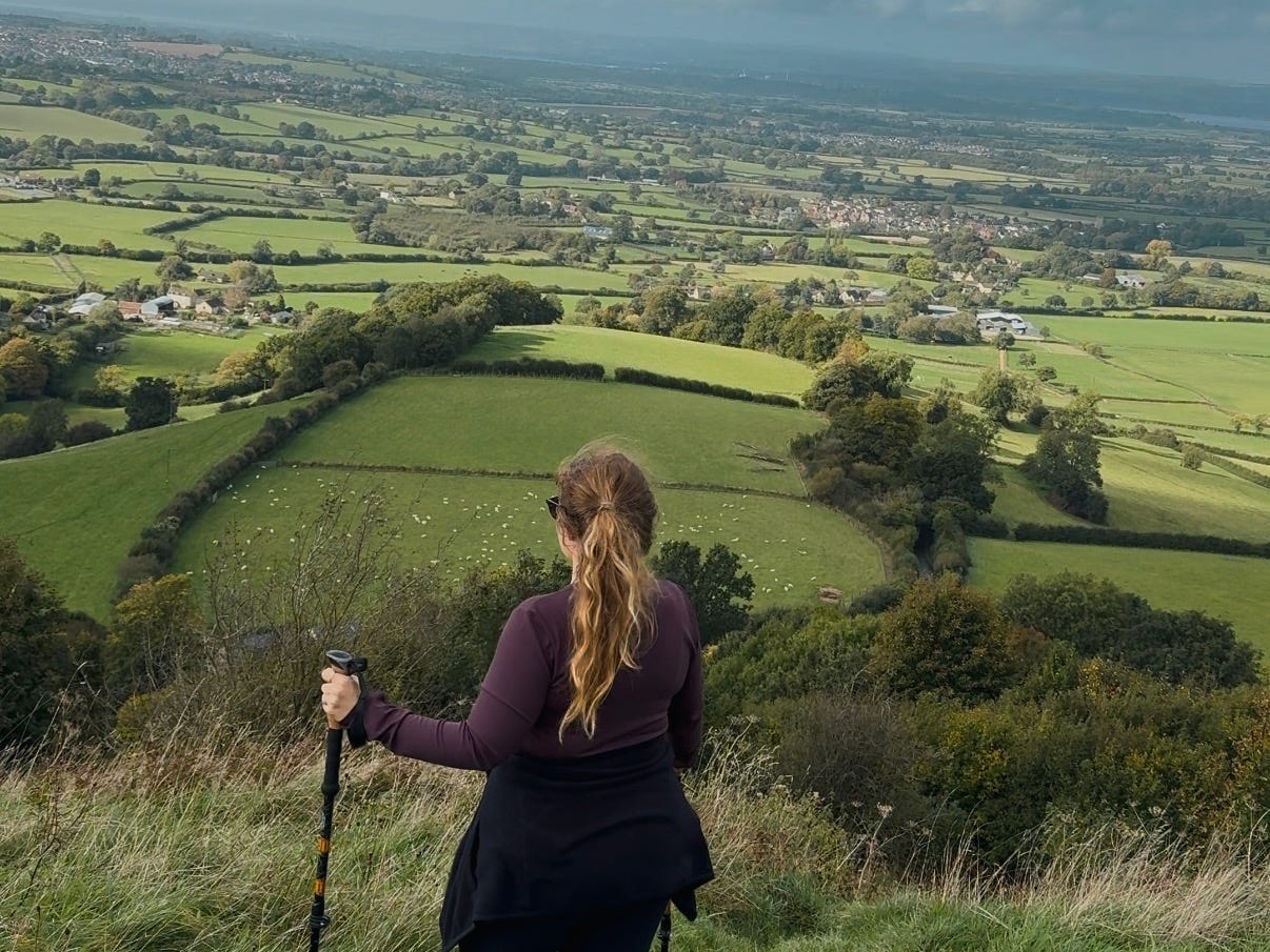 Helene Sula looking over a field on Cotswold Way.