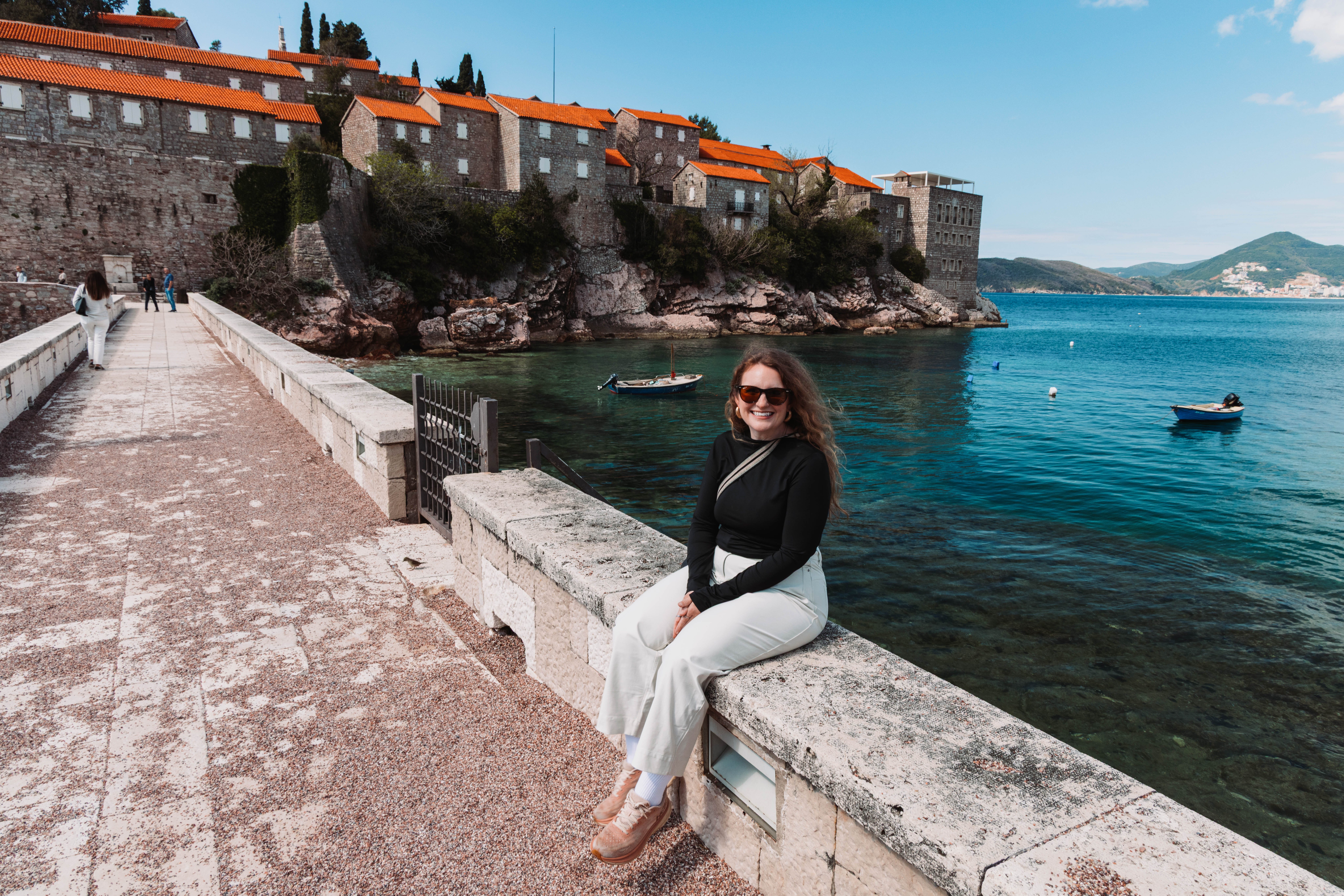 Helene Sula is sitting on a bridge in Montenegro.