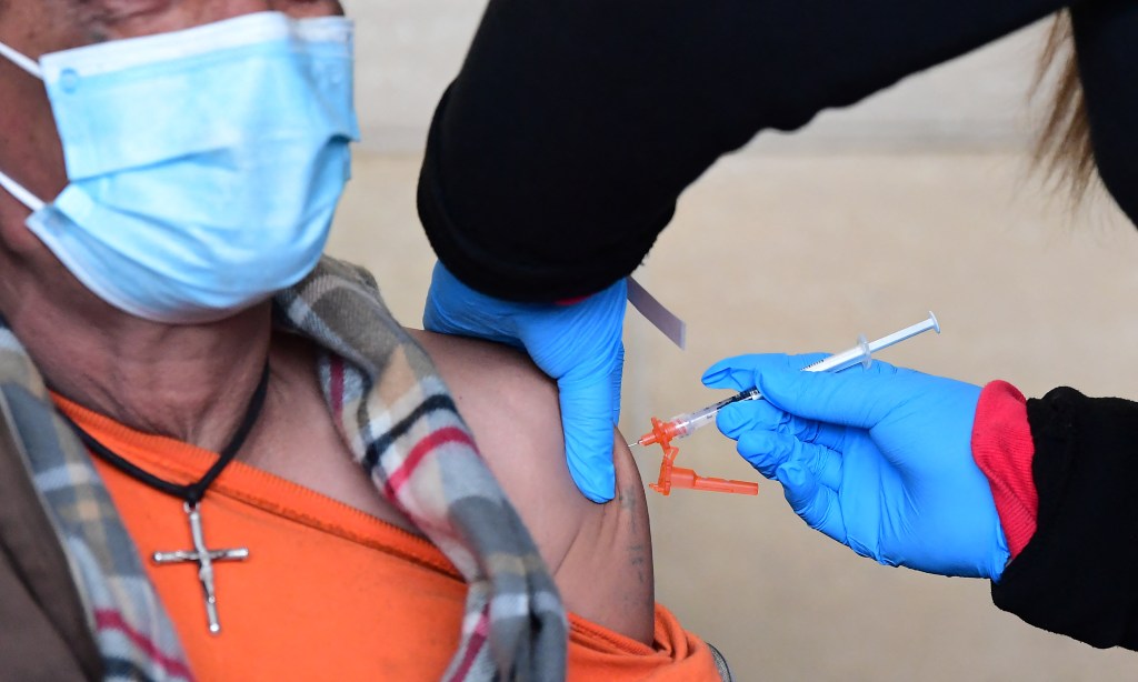 Man receiving a Covid-19 vaccine at Union Station in Los Angeles, California on January 7, 2022