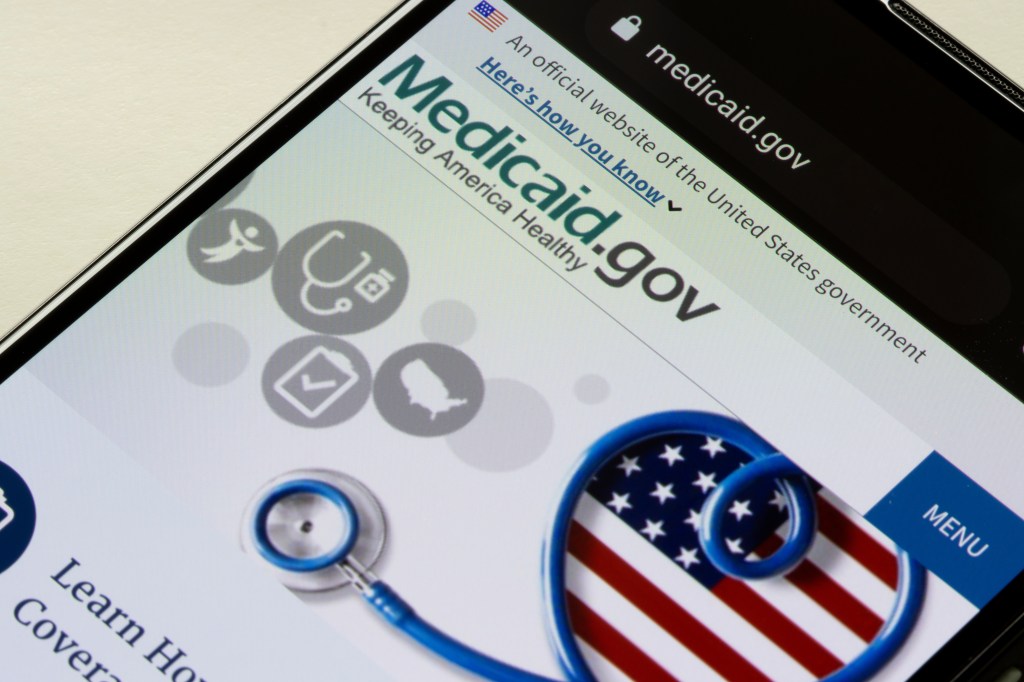 Closeup of the Medicaid.gov homepage displayed on a smartphone screen