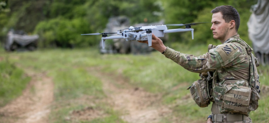 Spc. Anton Lane, a combat medic with specialized drone training, assigned to 5-7 Cavalry, 1st Armored Brigade Combat Team, 3rd Infantry Division prepares to deploy a Skydio X10E4TT drone by hand during exercise Combined Resolve 25-2 at Hohenfels, Germany on May 17, 2025.