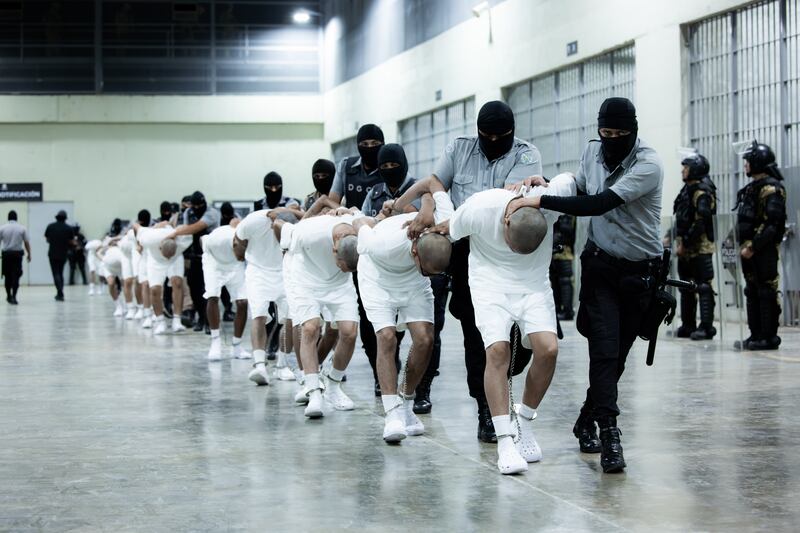 More than 250 suspected gang members arrive in El Salvador by plane.