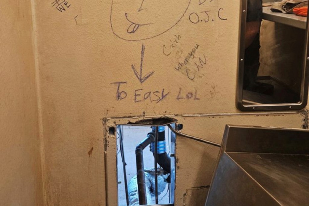 The inmates left a taunting message on the wall above the hole before their escape.