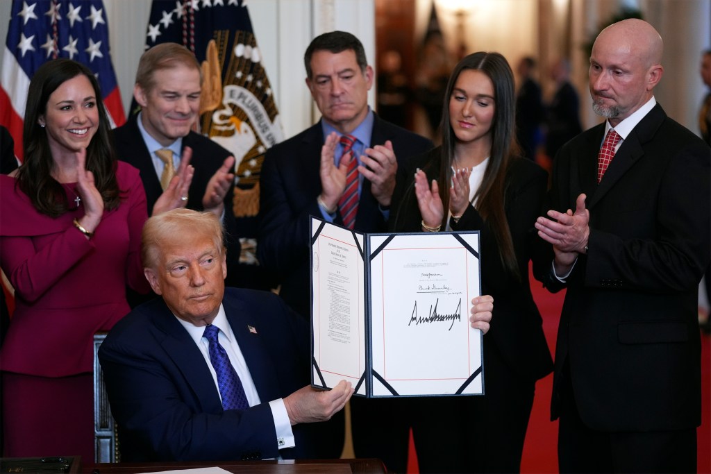 President Donald Trump the Laken Riley Act after signing it during an event in the East Room of the White House, Jan. 29, 2025, in Washington. (AP Photo/Evan Vucci)