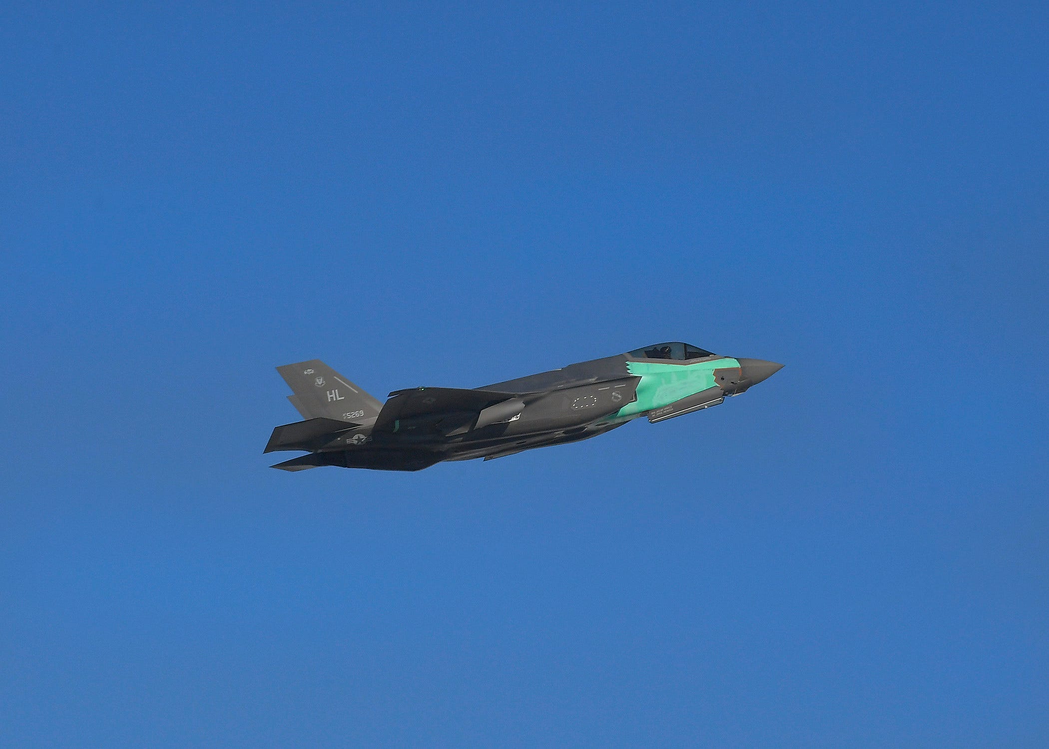 A F-35A restored from two damaged aircraft flies during its functional check flight.