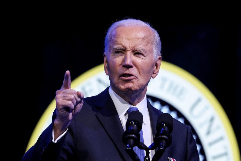 Joe Biden gestures while speaking speaks at a Department of Defense Commander in Chief farewell ceremony.