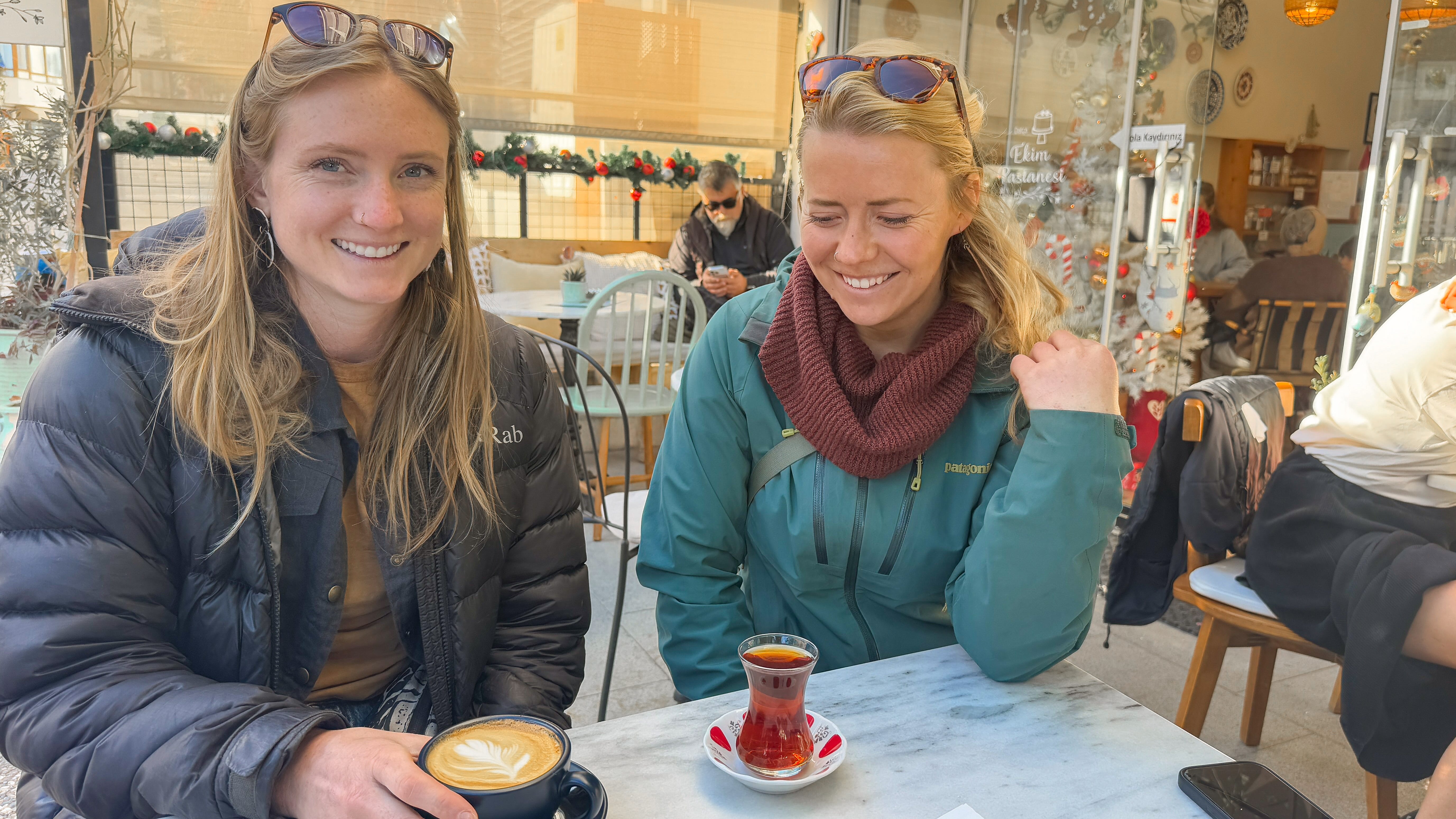Women with dessert and coffee in cafe