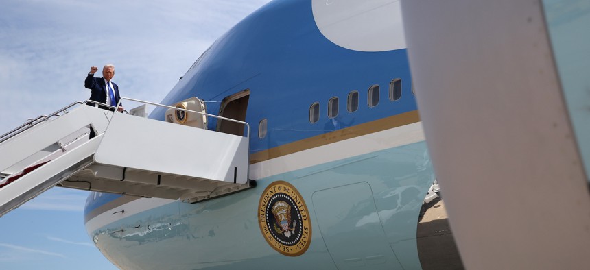 President Donald Trump boards Air Force One on May 12, 2025, at Joint Base Andrews, Maryland, for a trip to the Middle East.