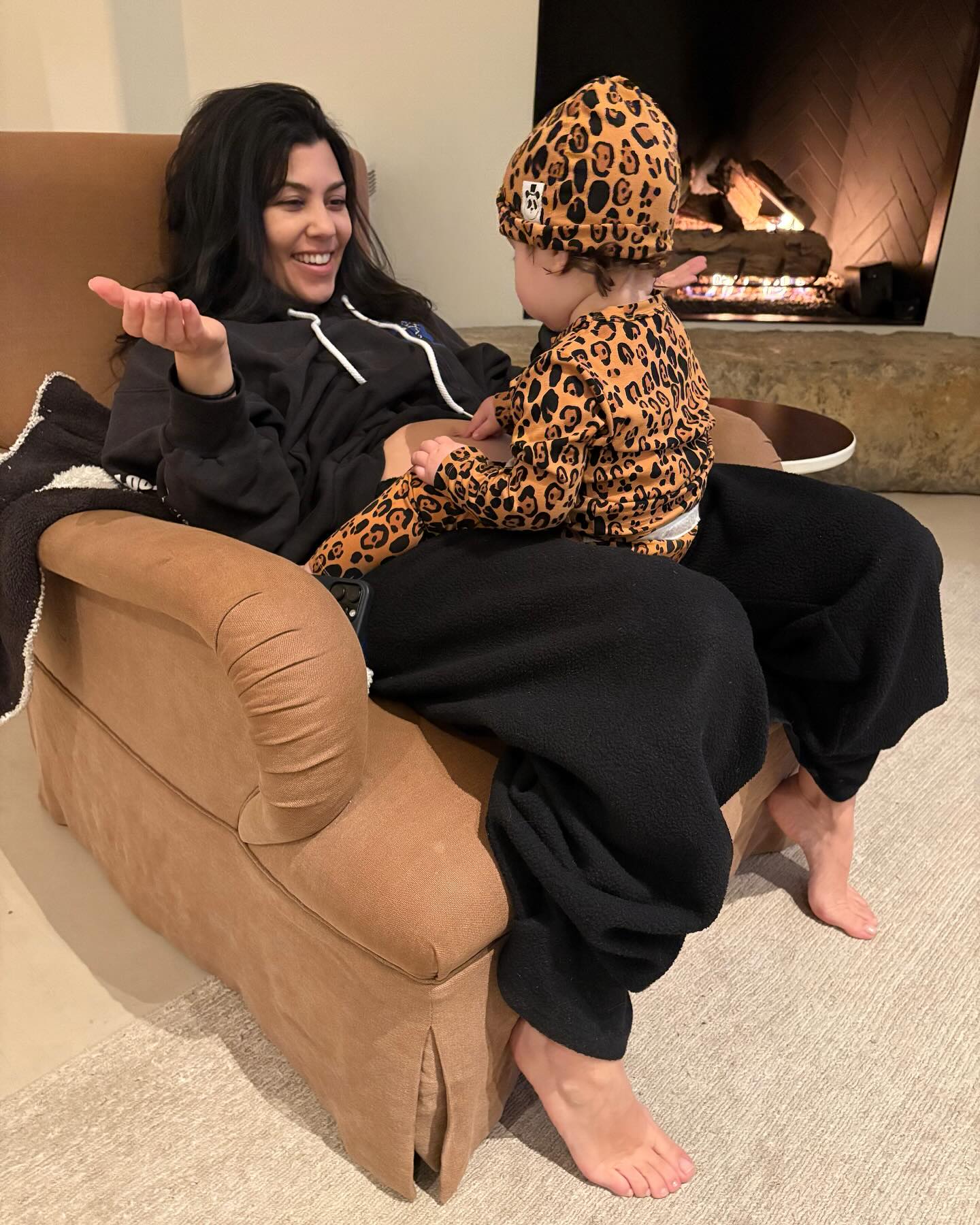 Kourtney Kardashian with Rocky Barker on her lap