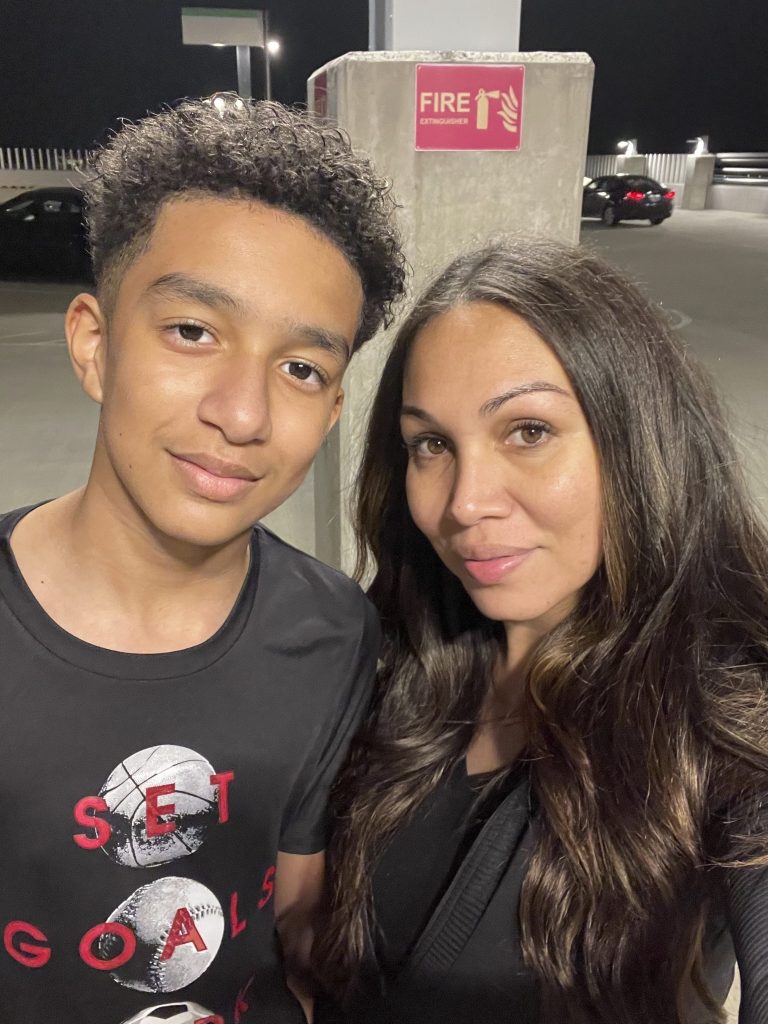 Megan Garcia standing with her son Sewell Setzer III, who is alleged to be a victim of a Character.AI chatbot.