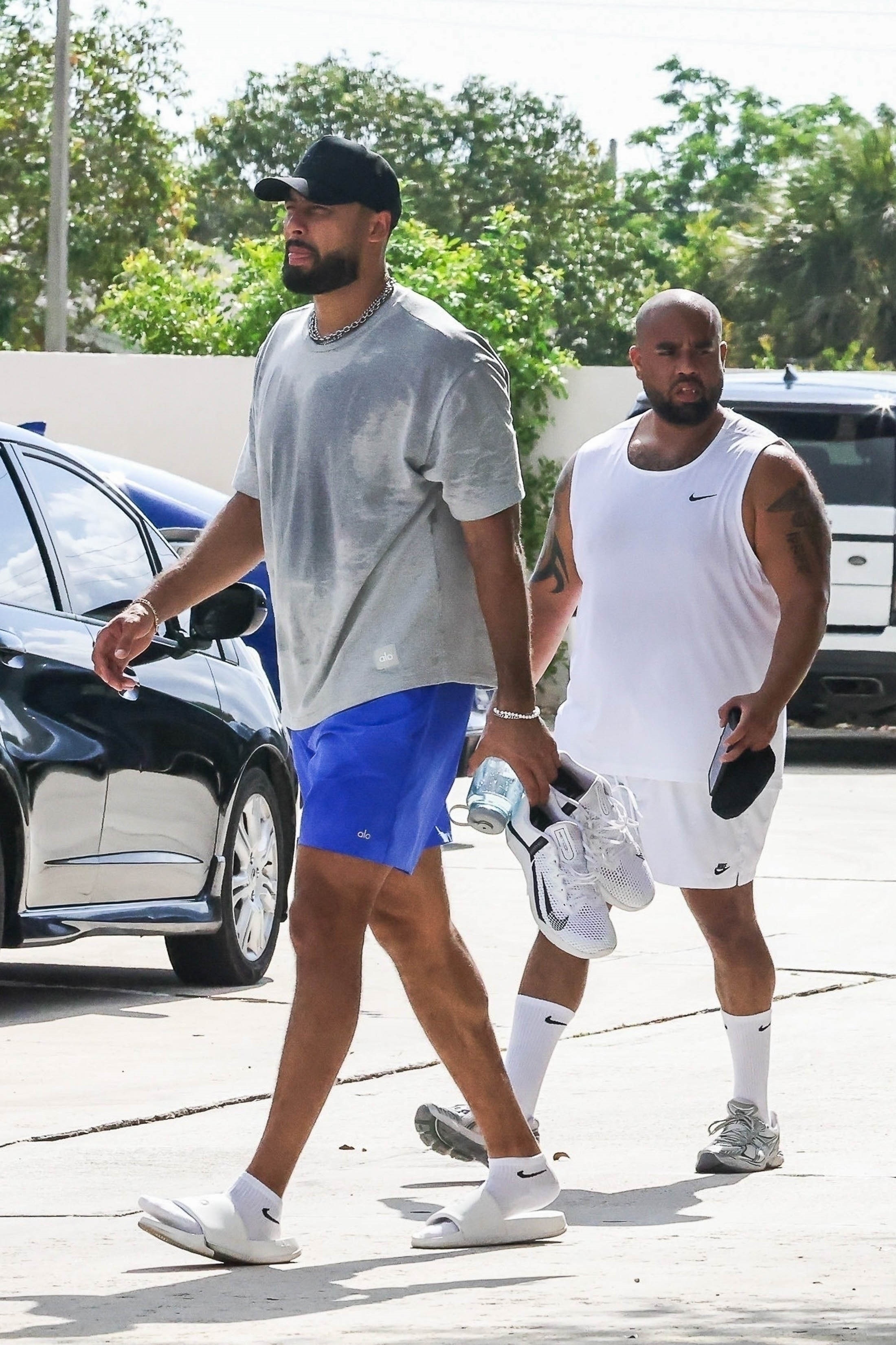 Ross Travis and Kumar Ferguson in sweaty workout gear. 