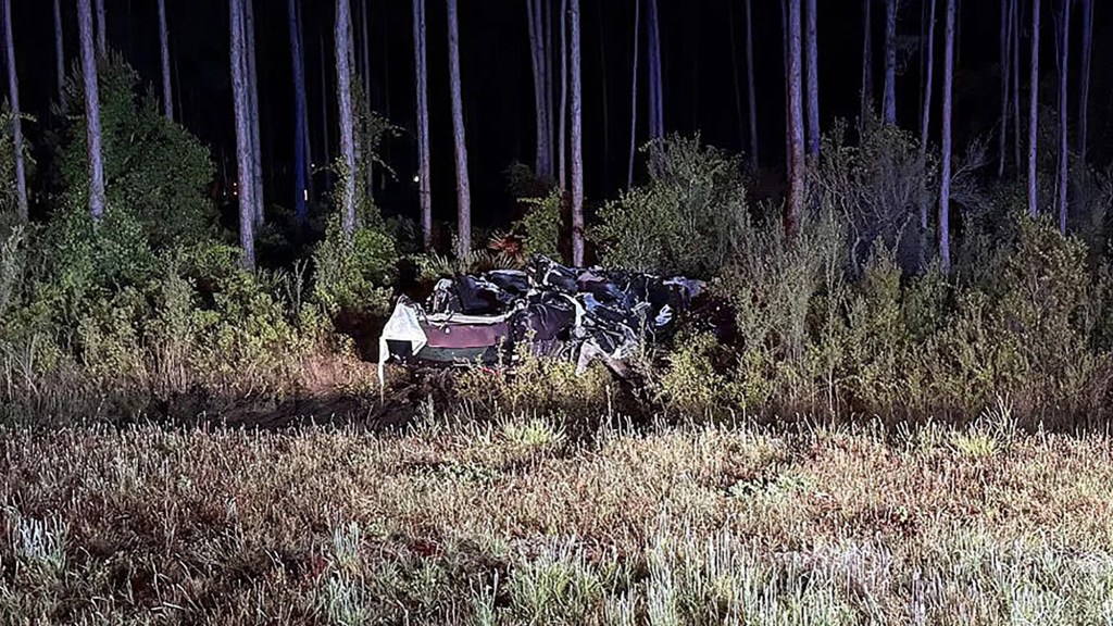 The force of the wreck caused the SUV to cross the median and stop in a wooded area on the opposite side of the highway, the Florida Highway Patrol said.