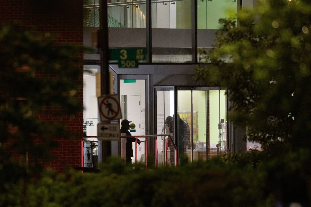 Law enforcement work the scene after two staff members of the Israeli Embassy in Washington were shot and killed outside the Capital Jewish Museum, Thursday, May 22, 2025, in Washington.