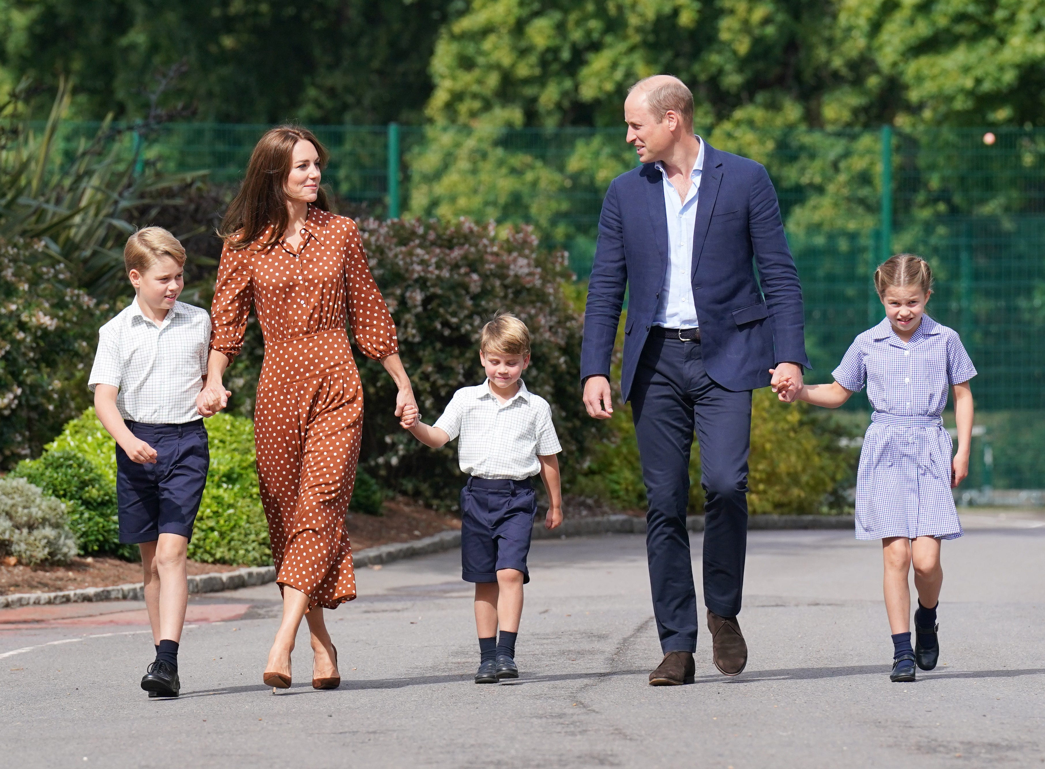 Prince George, Kate Middleton, Prince Louis, Prince William, and Princess Charlotte walk hand in hand into Lambrook School.
