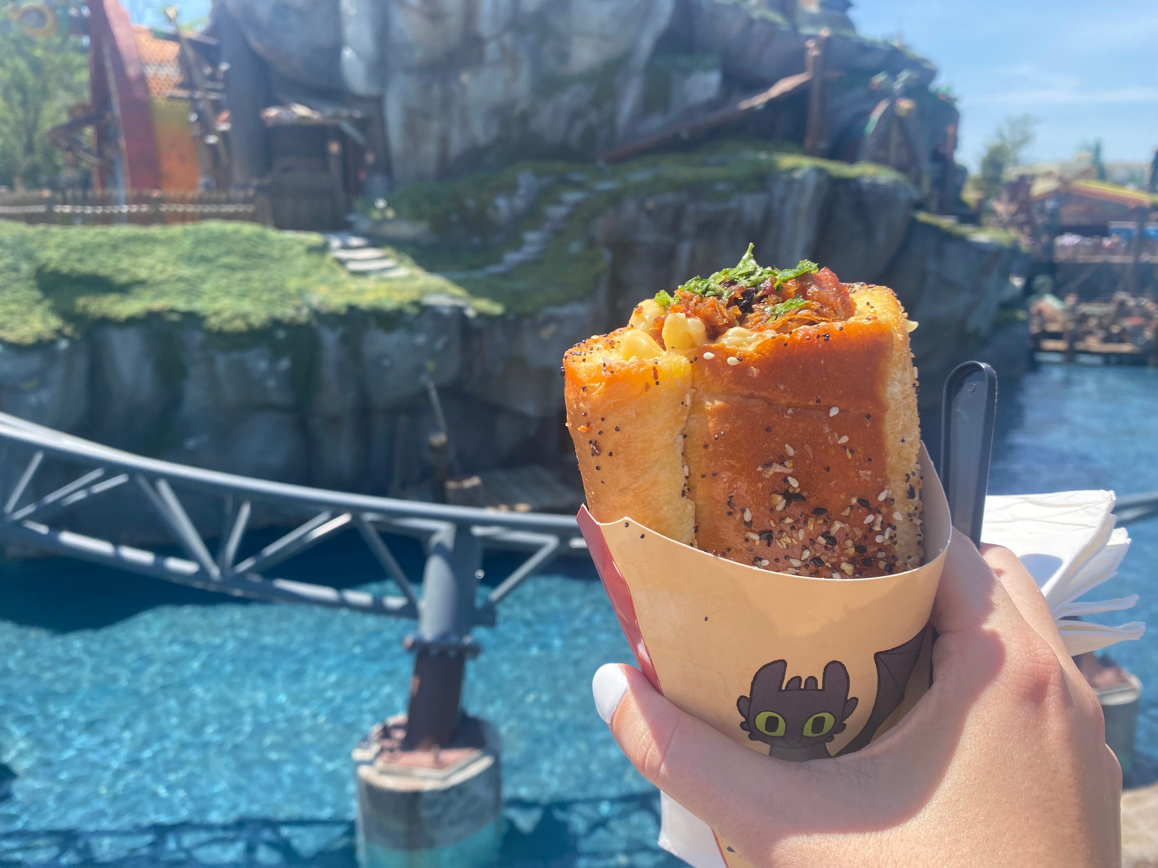 Mac and cheese in a cone with toothless dragon paper on it