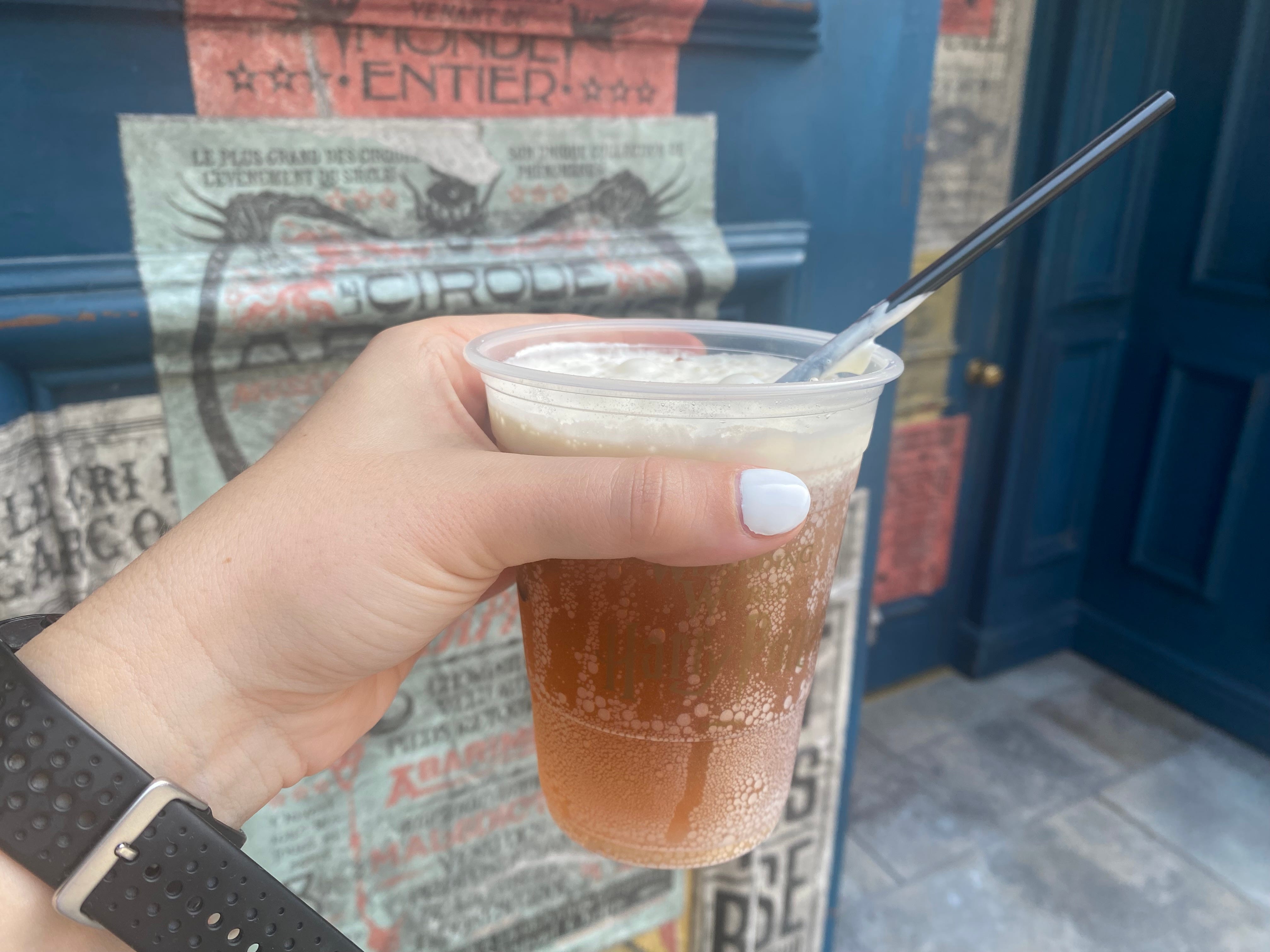 Butterbeer in hand at Epic Universe