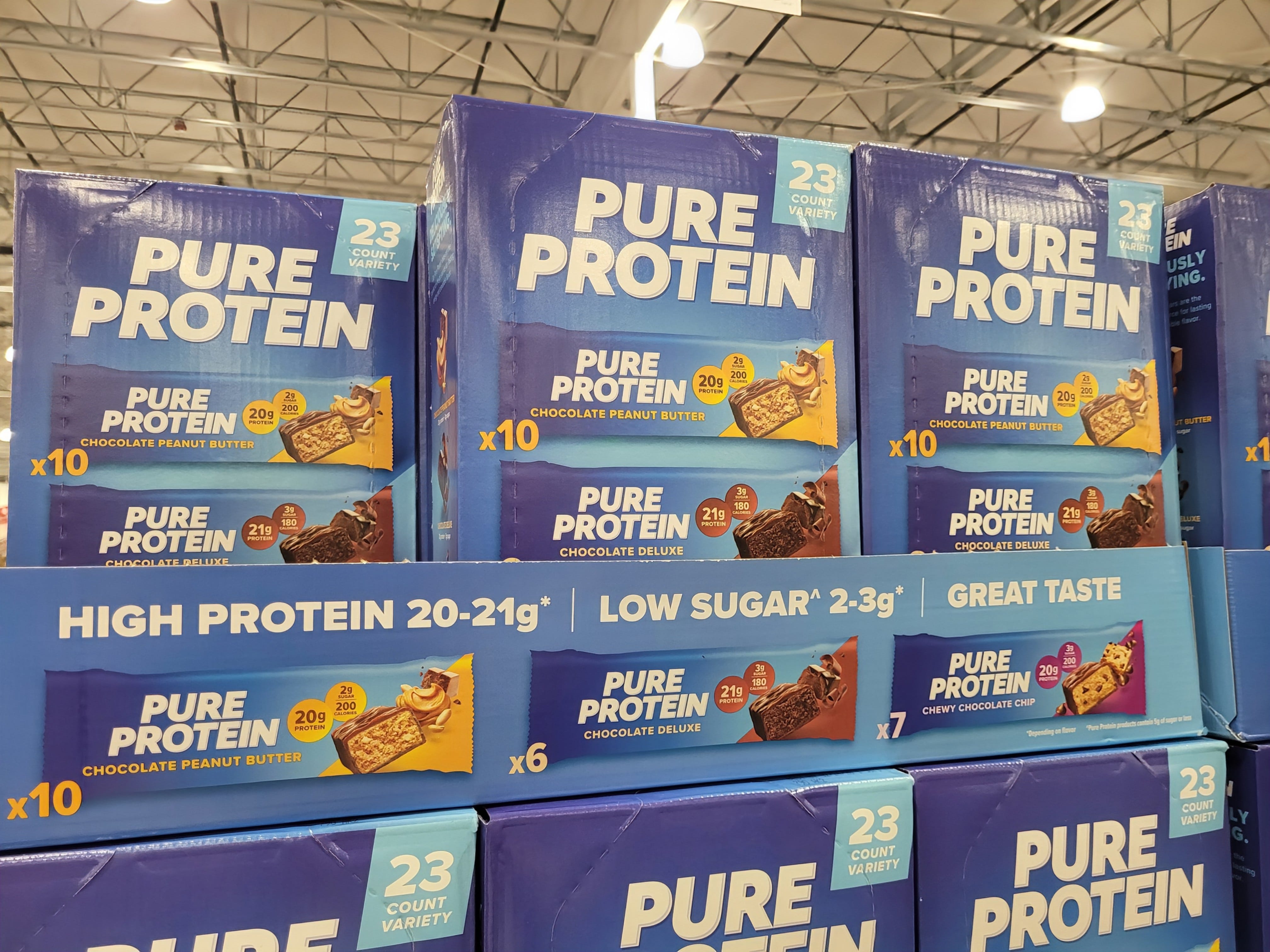 Boxes of Pure Protein bars on display.