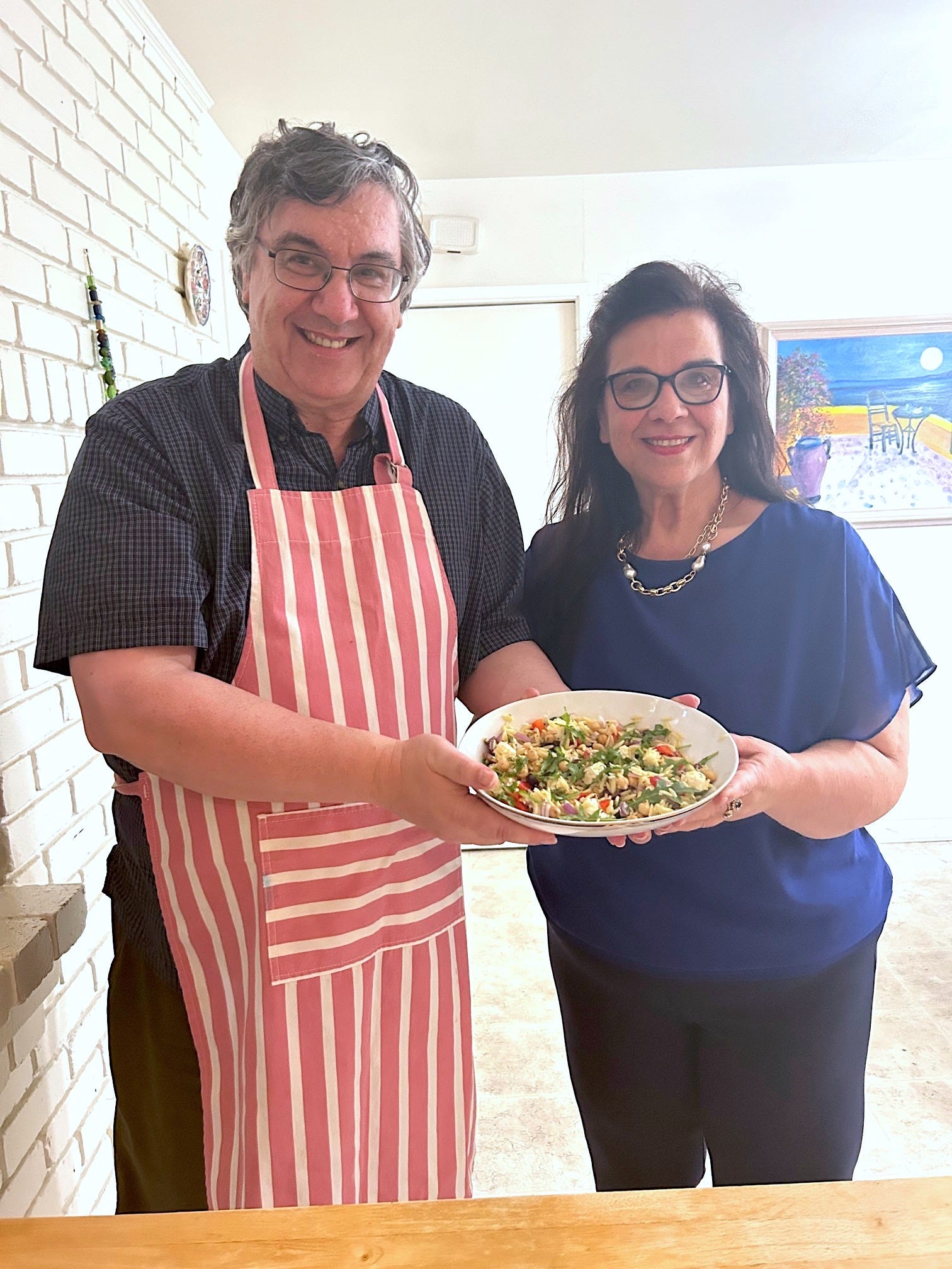 Anneta's parents with Ina Garten's Greek Orzo salad