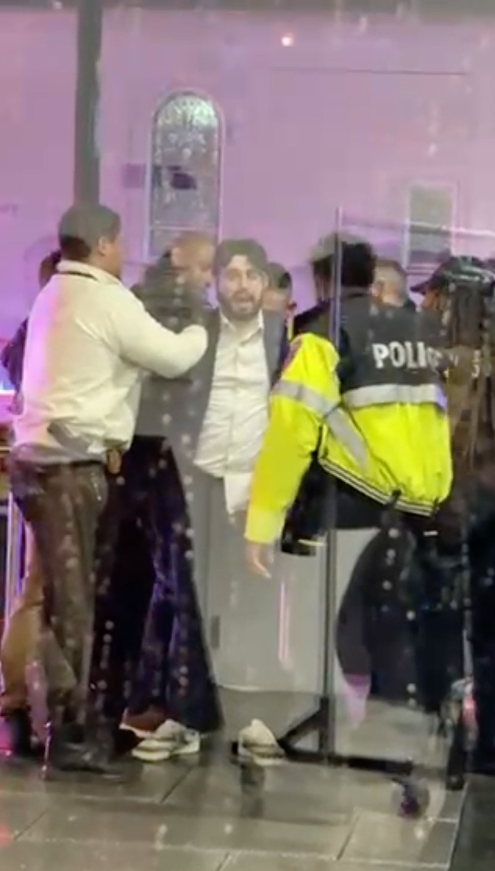 Accused terrorist Elias Rodriguez is searched after the deadly attack.