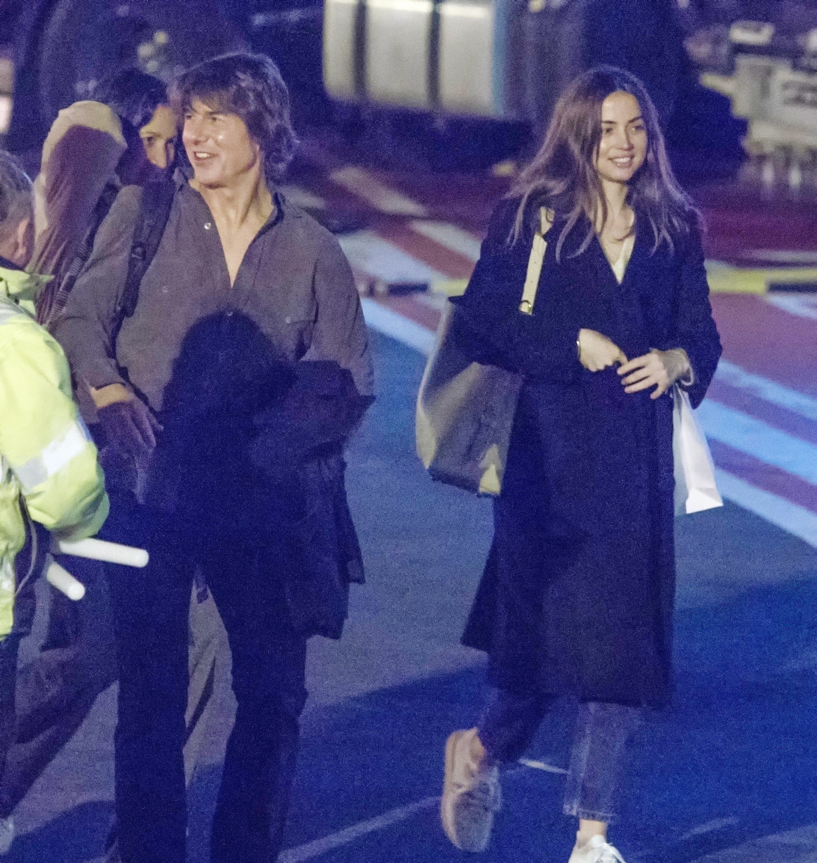 Tom Cruise and Ana de Armas at a heliport. 