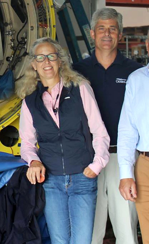 Wendy and Stockton Rush pose for a photo next to a submersible vessel in an undated photo.