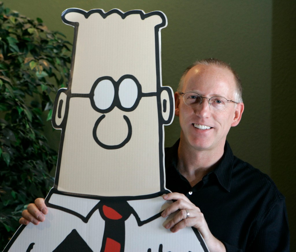 Adams, creator of the comic strip Dilbert, poses for a portrait with the Dilbert character in his studio in Dublin, Calif., Oct. 26, 2006. 