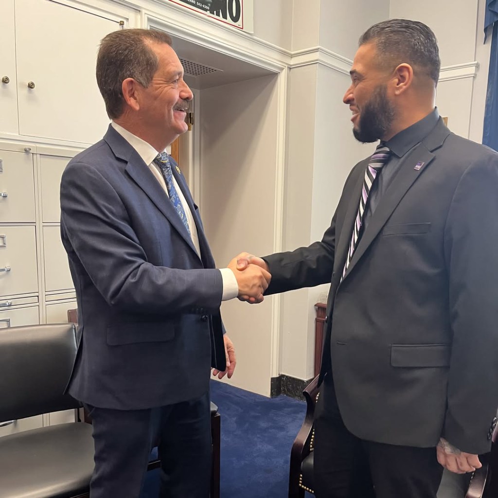 Eric Rodriguez with Chicago congressman Chuy Garcia. 
