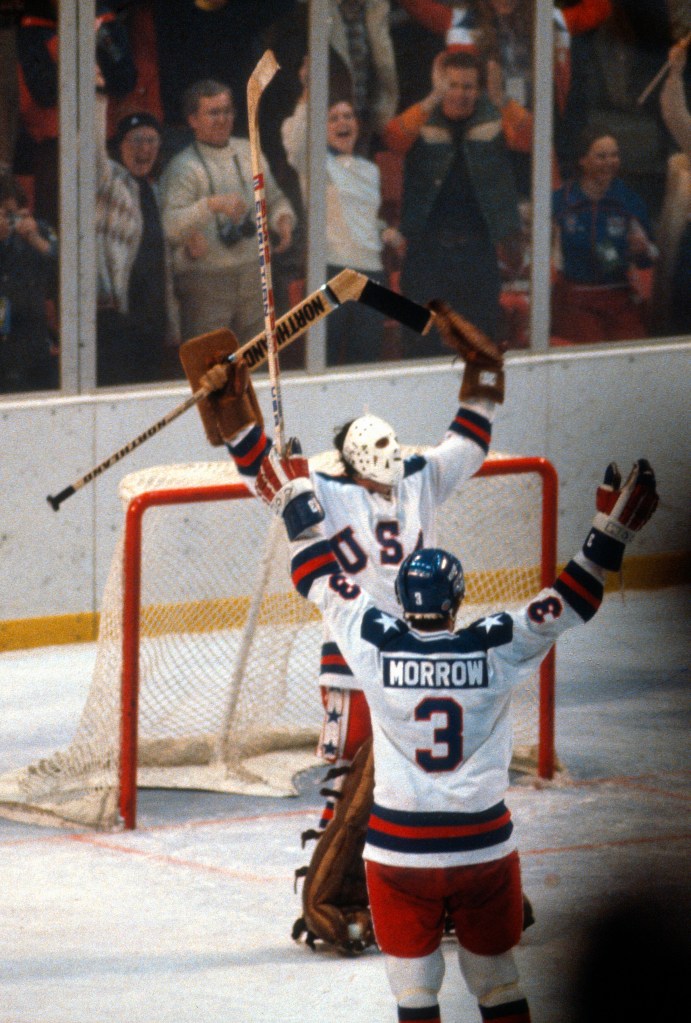  Jim Craig #30 and Ken Morrow #3 of the United States Hockey team celebrates after they defeated the Soviet Union during a metal round game of the Winter Olympics February 22, 1980 at the Olympic Center in Lake Placid, New York. 
