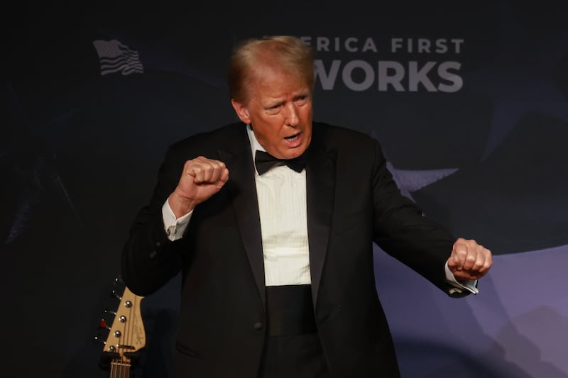 Donald Trump gestures while wearing a tuxedo at an America First Policy Institute Gala held at Mar-a-Lago.