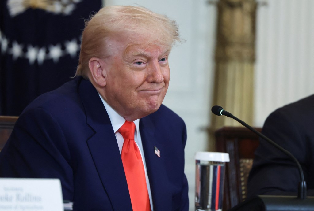 President Donald Trump applauding at a MAHA Commission event in the East Room of the White House, acknowledging Russia and Ukraine on their prison exchange.