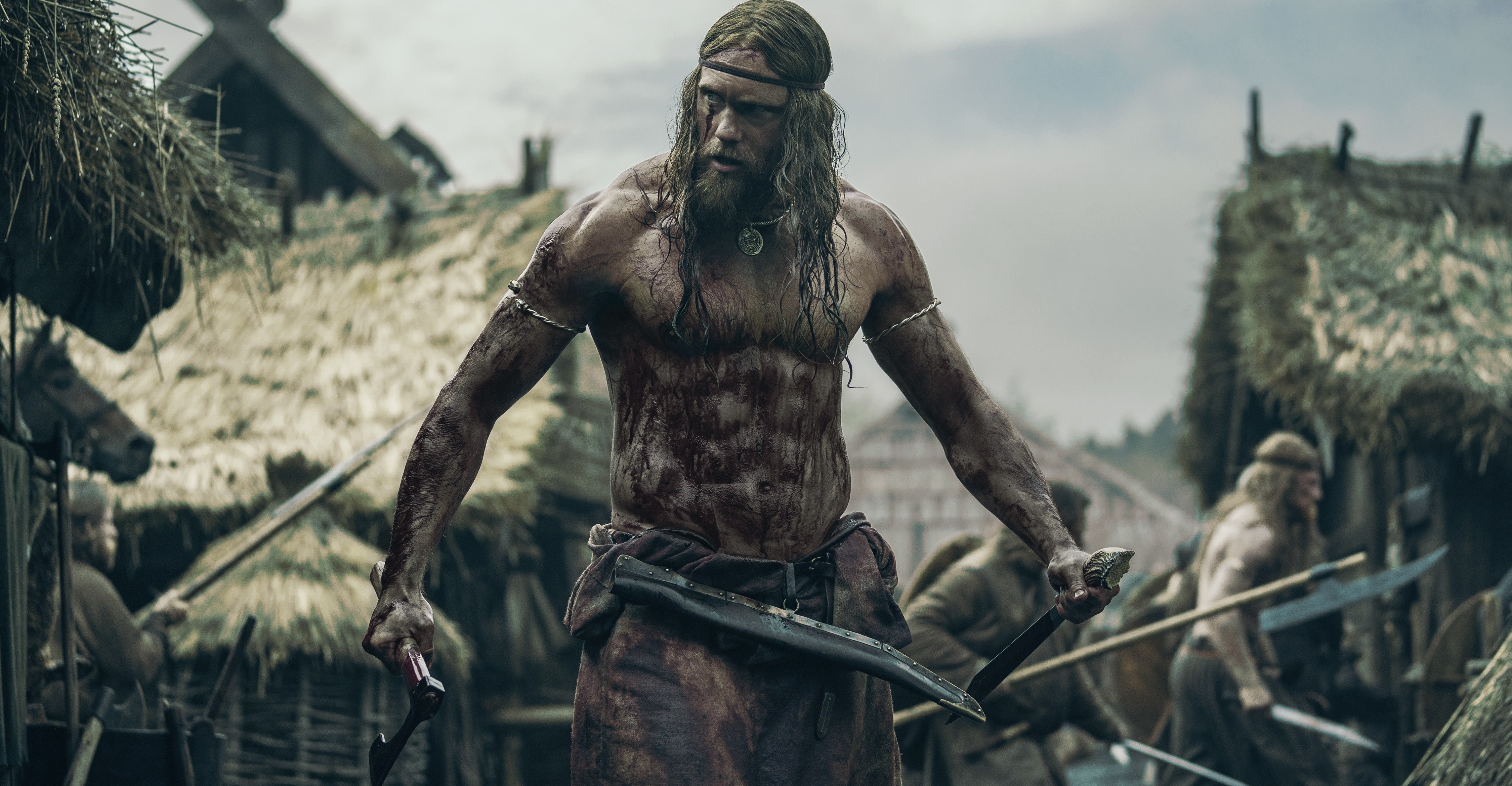 Alexander Skarsgård stands as a Viking warrior in The Northman