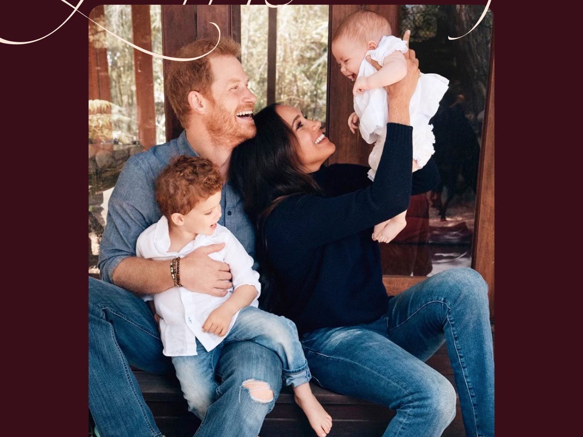 Prince Harry and Meghan Markle's holiday card is the first photo they've shared as a family of four. Meghan holds her daughter Lilibet in the air, while Harry has their son Archie in his lap.