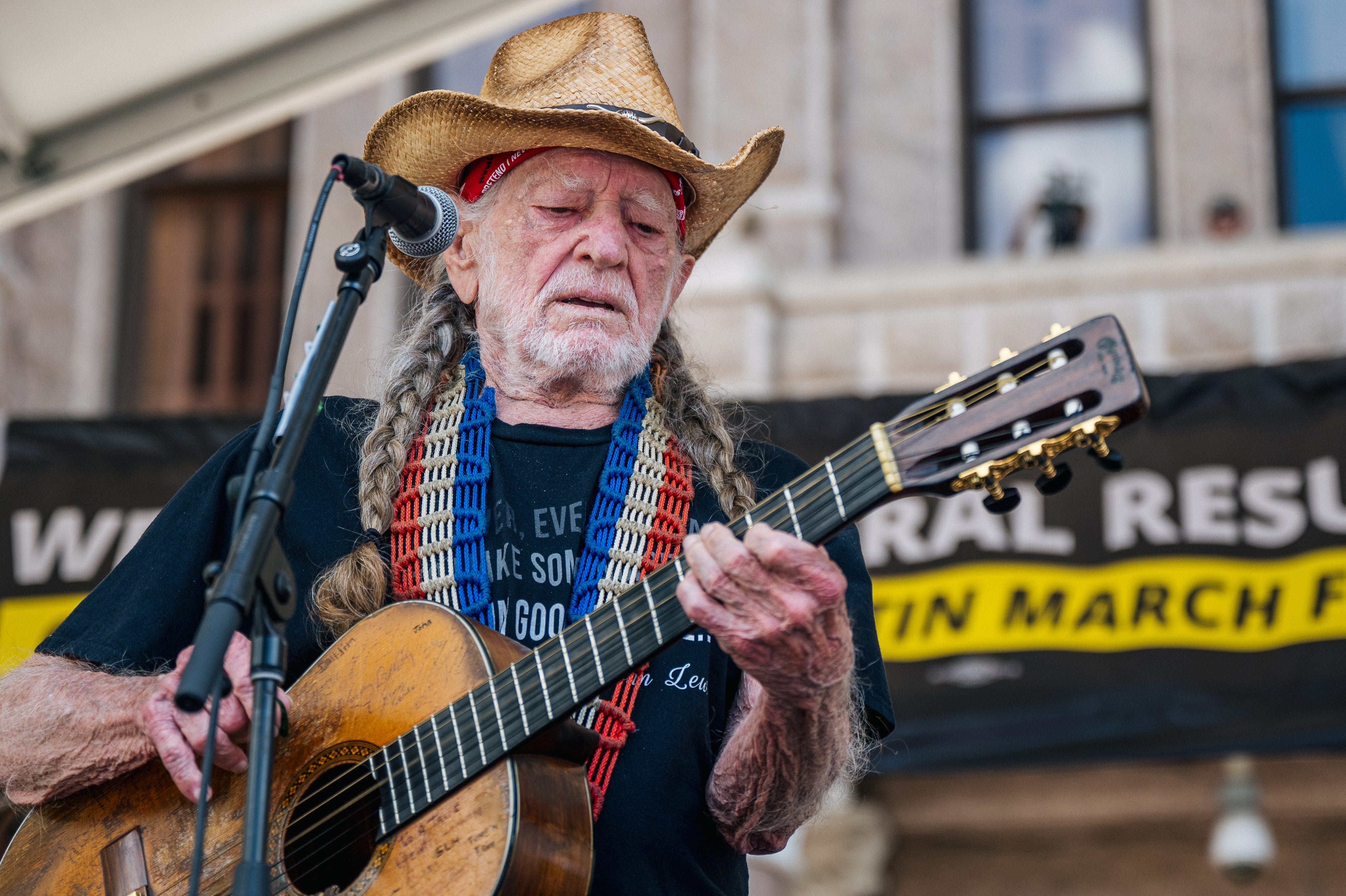 Musician Willie Nelson performs during the Georgetown to Austin March for Democracy rally on July 31, 2021 in Austin, Texas.