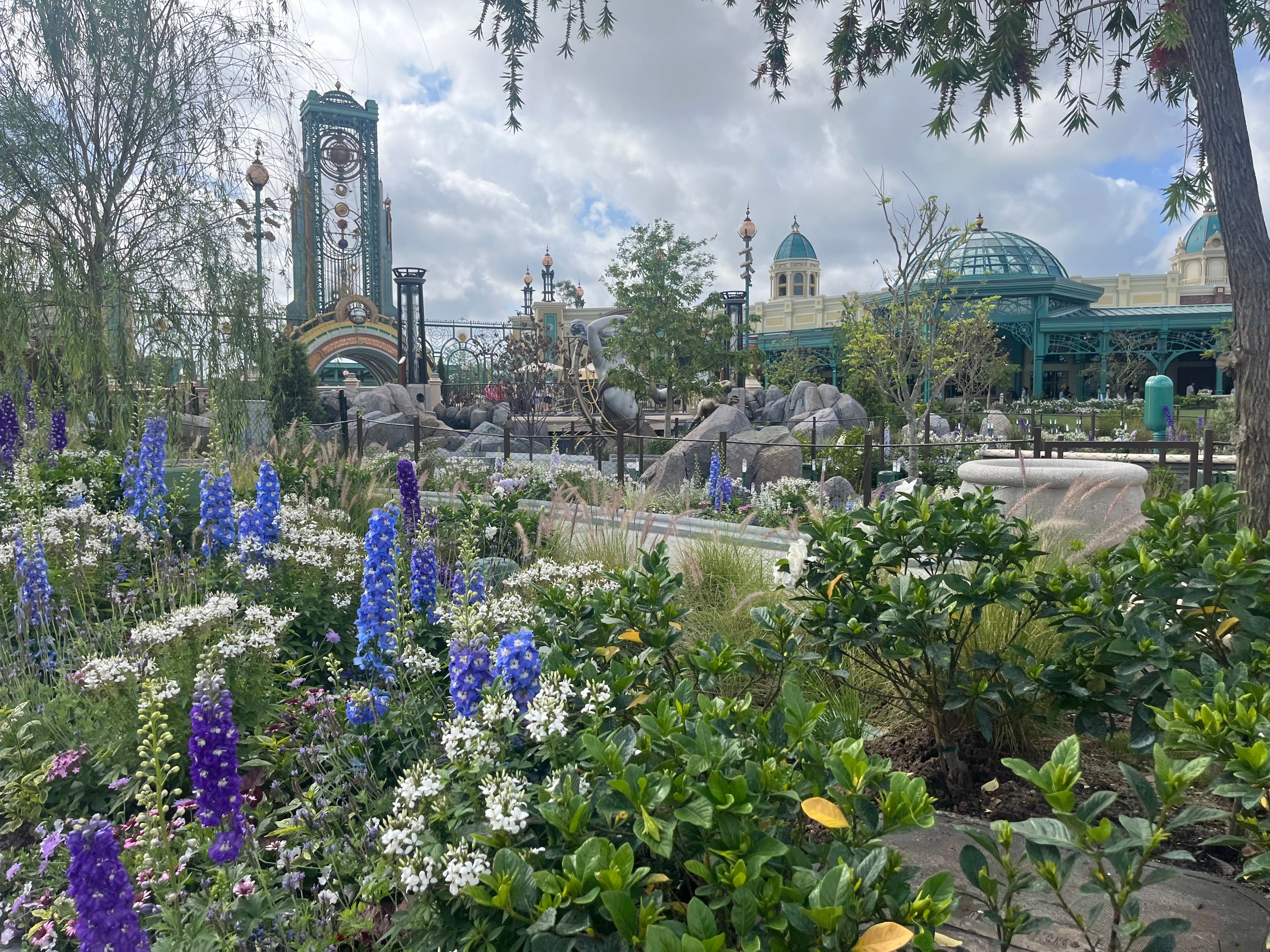 Gardens with flowers throughout Epic Universe's Celestial Park