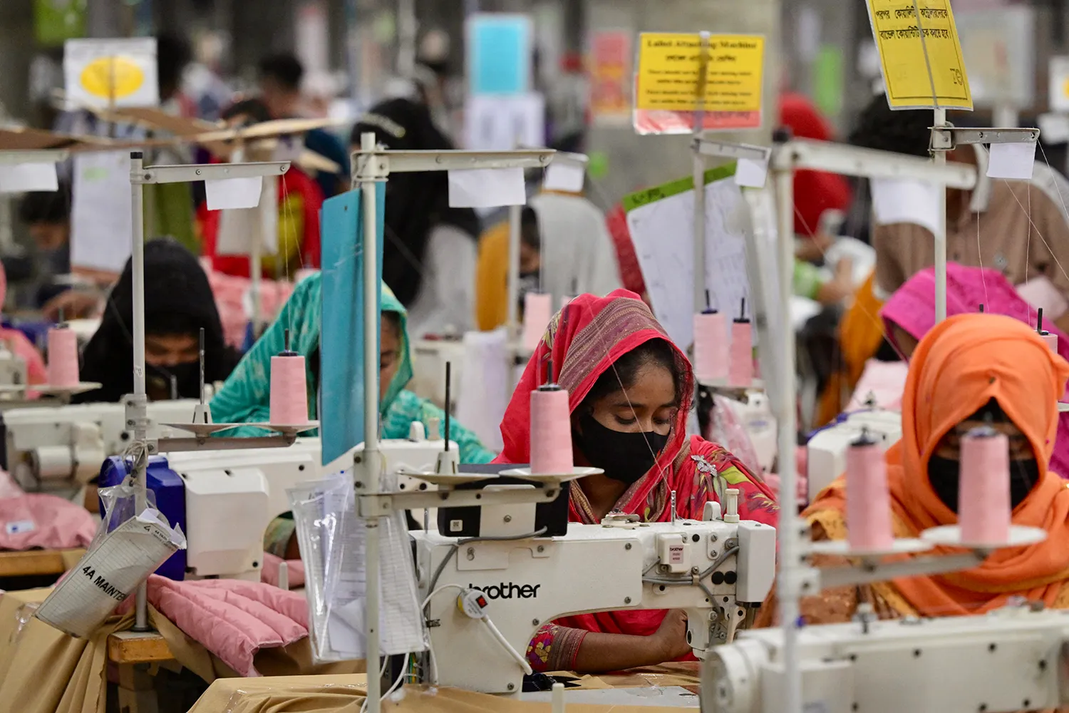 Workers at their sewing stations in a garment factory in Savar, Bangladesh.