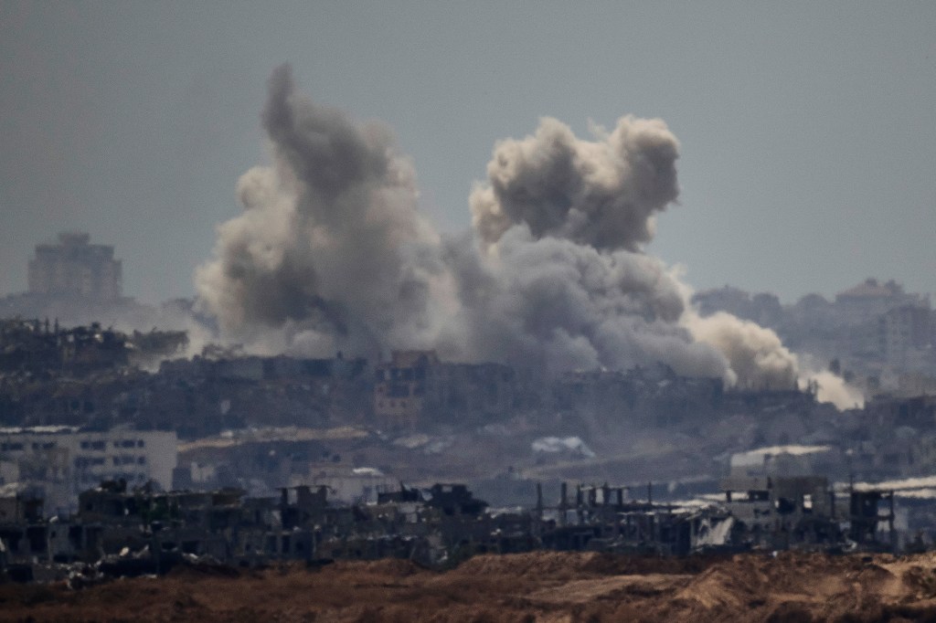 Smoke rises to the sky after an explosion in the Gaza Strip as seen from Sderot, southern Israel, Thursday, May 22, 2025.