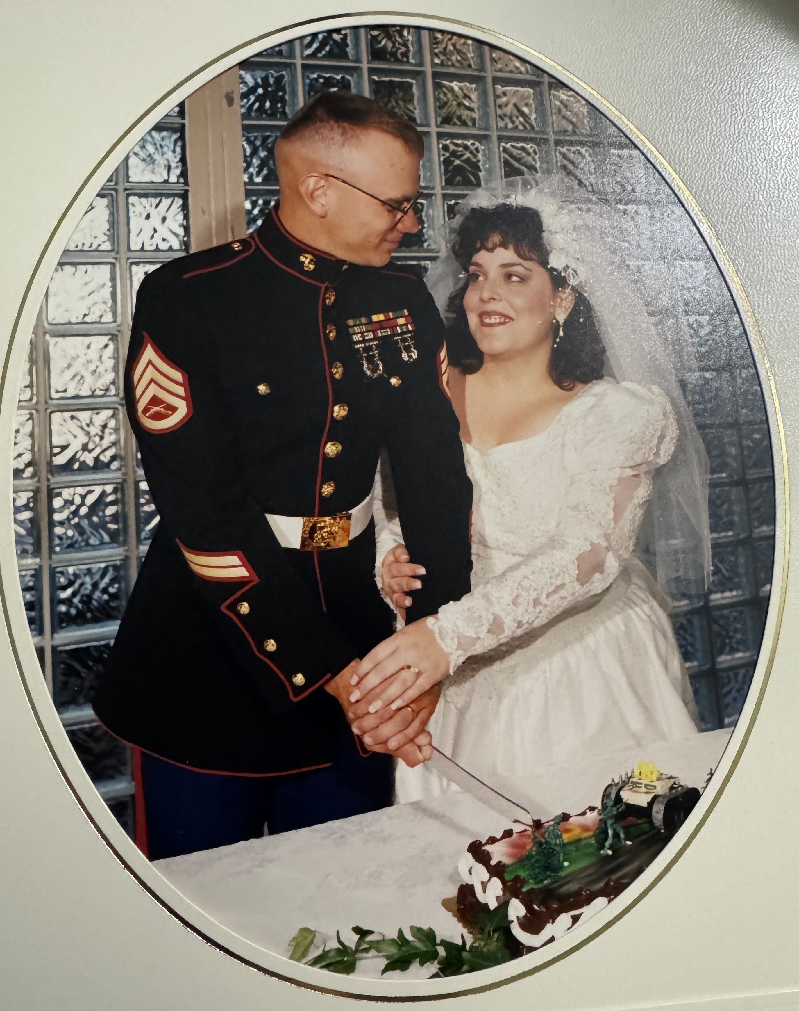 Couple cutting wedding cake