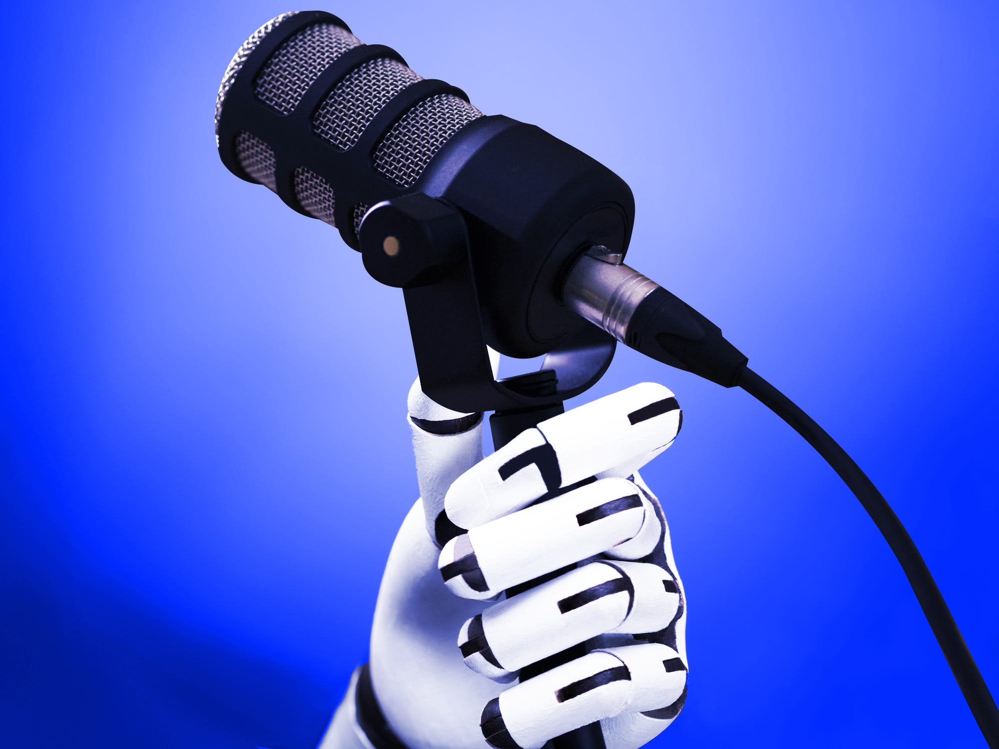 A robot holding a microphone