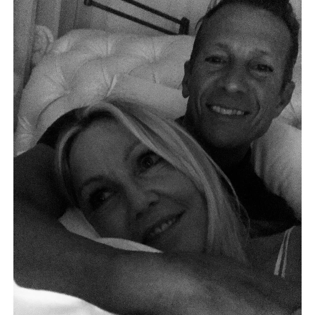 Heather Locklear and Chris Heisser in bed.