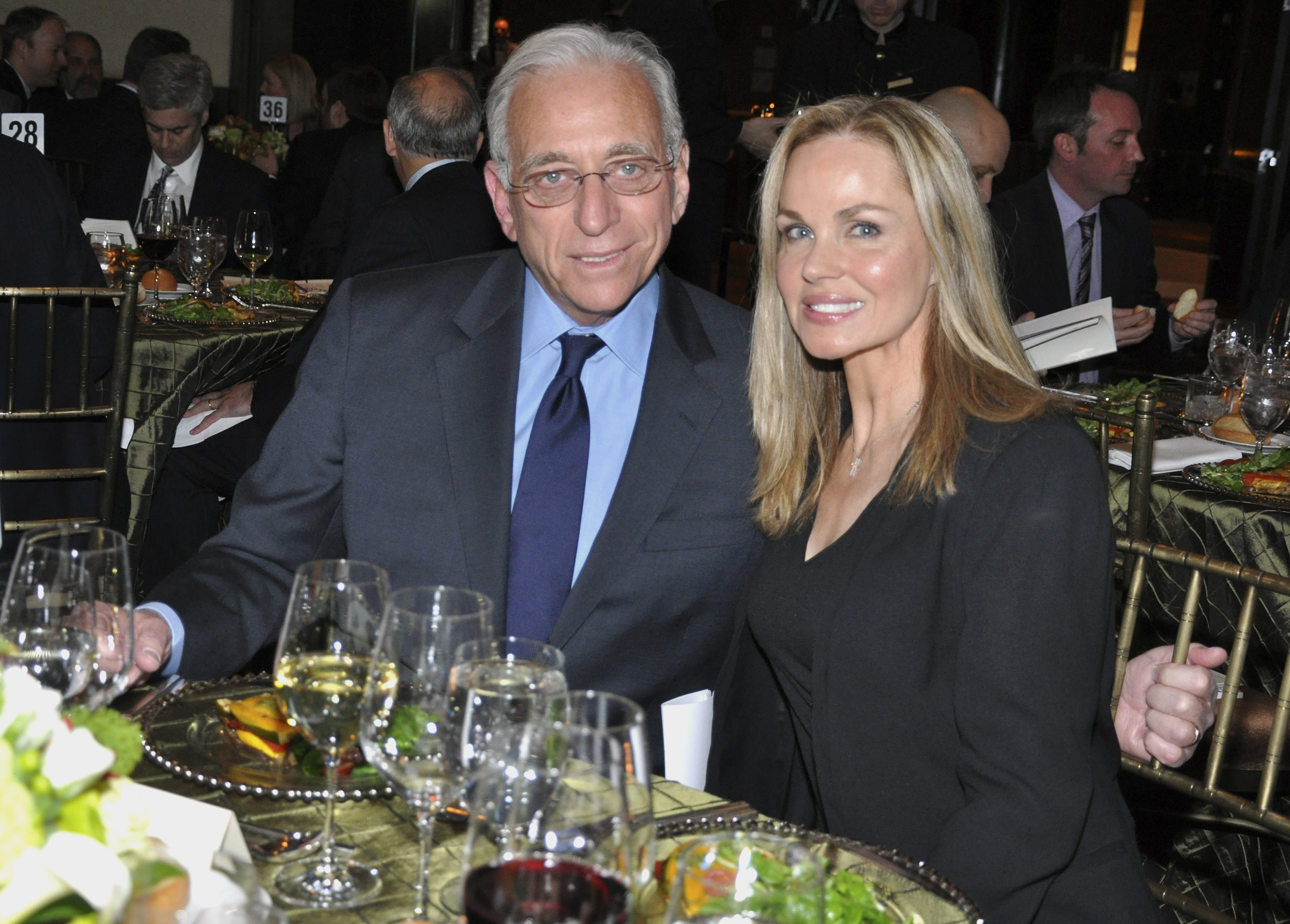 Claudia and Nelson Peltz at a table. 