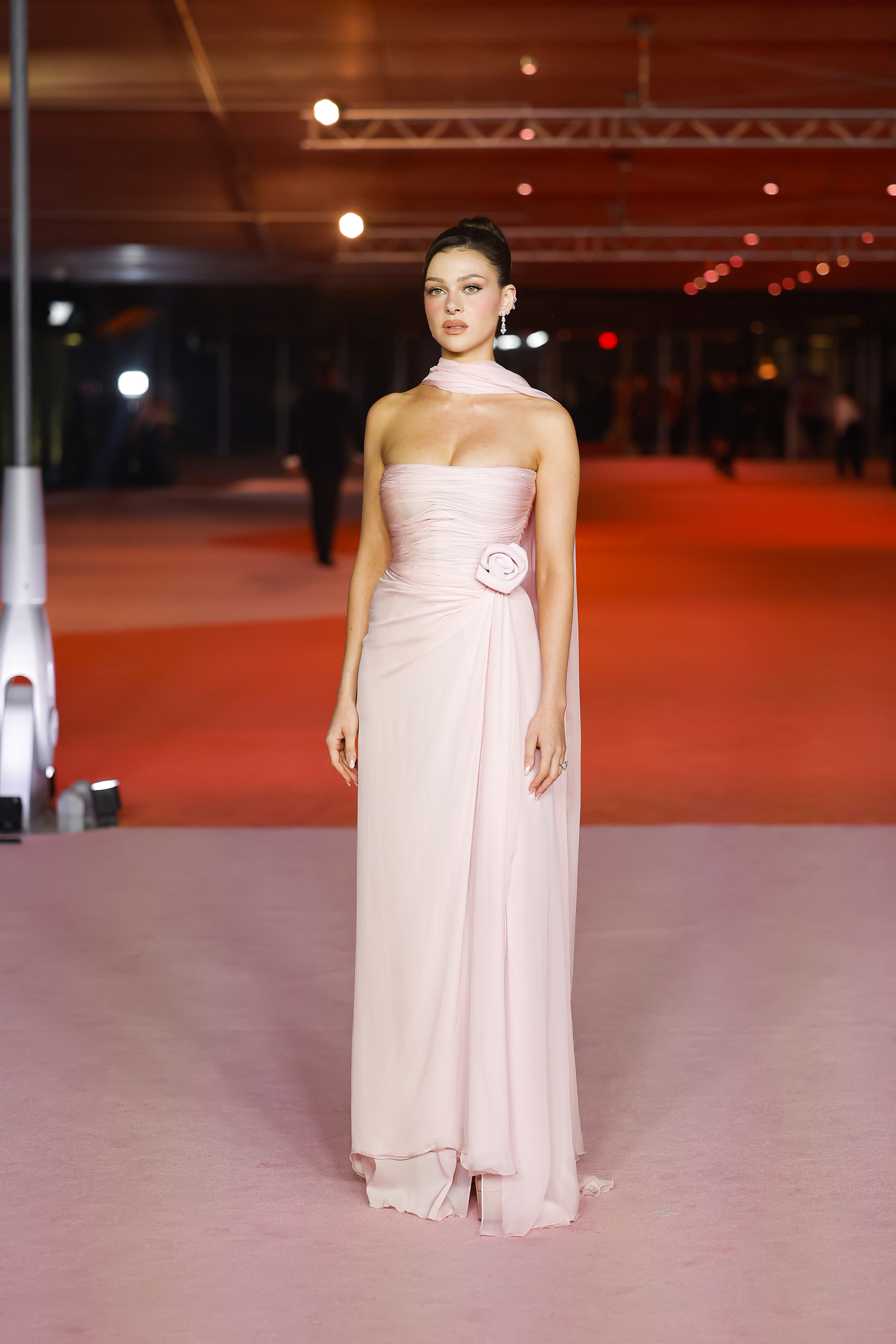 Nicola Peltz in a pink strapless dress. 