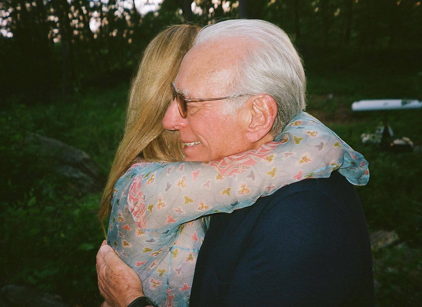 Nicola Peltz hugs Nelson Peltz. 