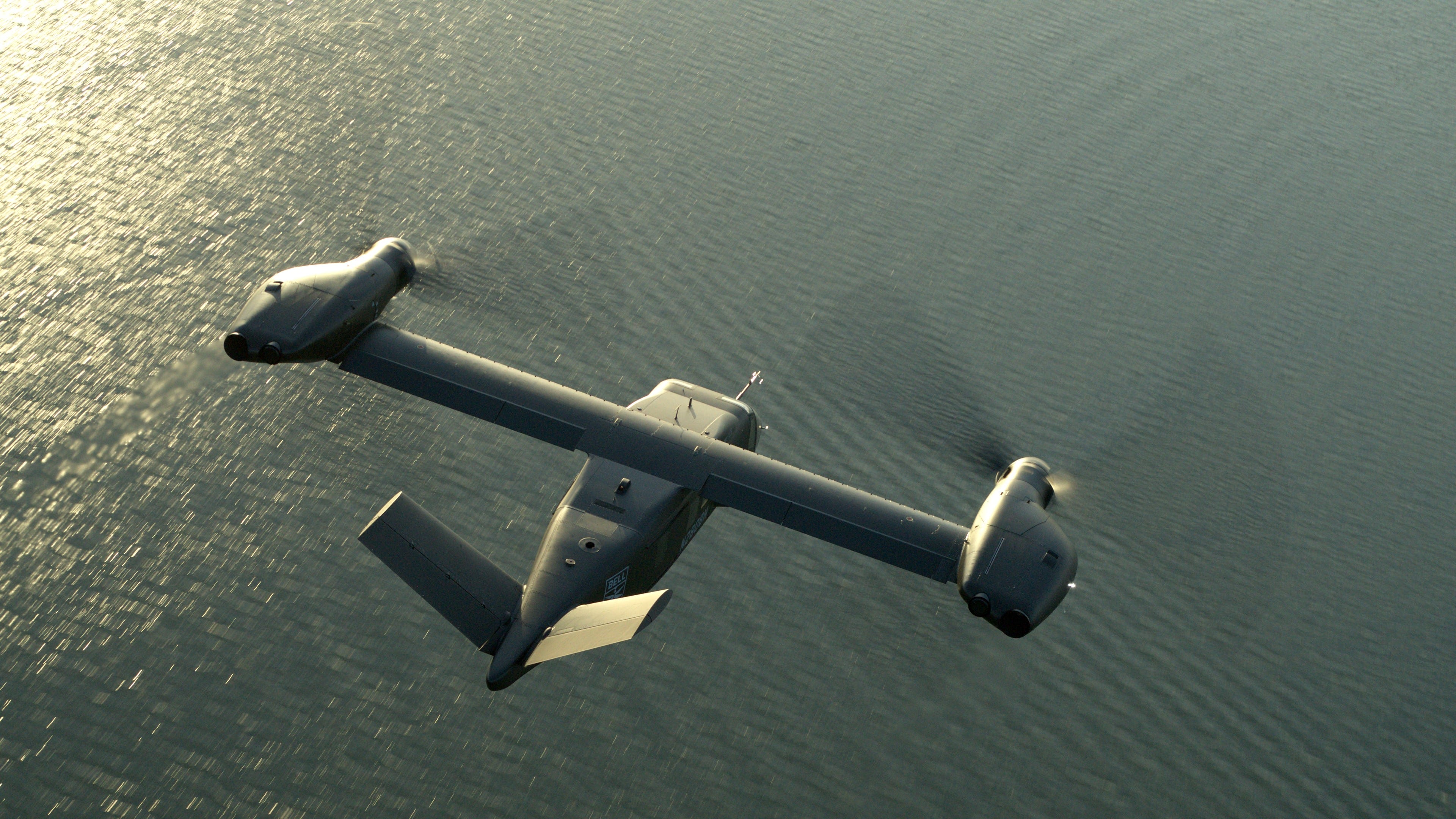 A top view of the V-280 as it flies over water.