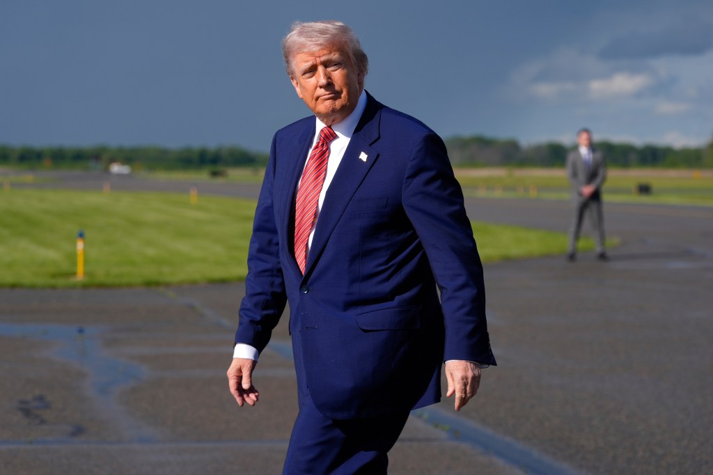 President Donald Trump steps off Air Force One after arriving at Morristown Municipal Airport in Morristown, NJ, on May 23, 2025.