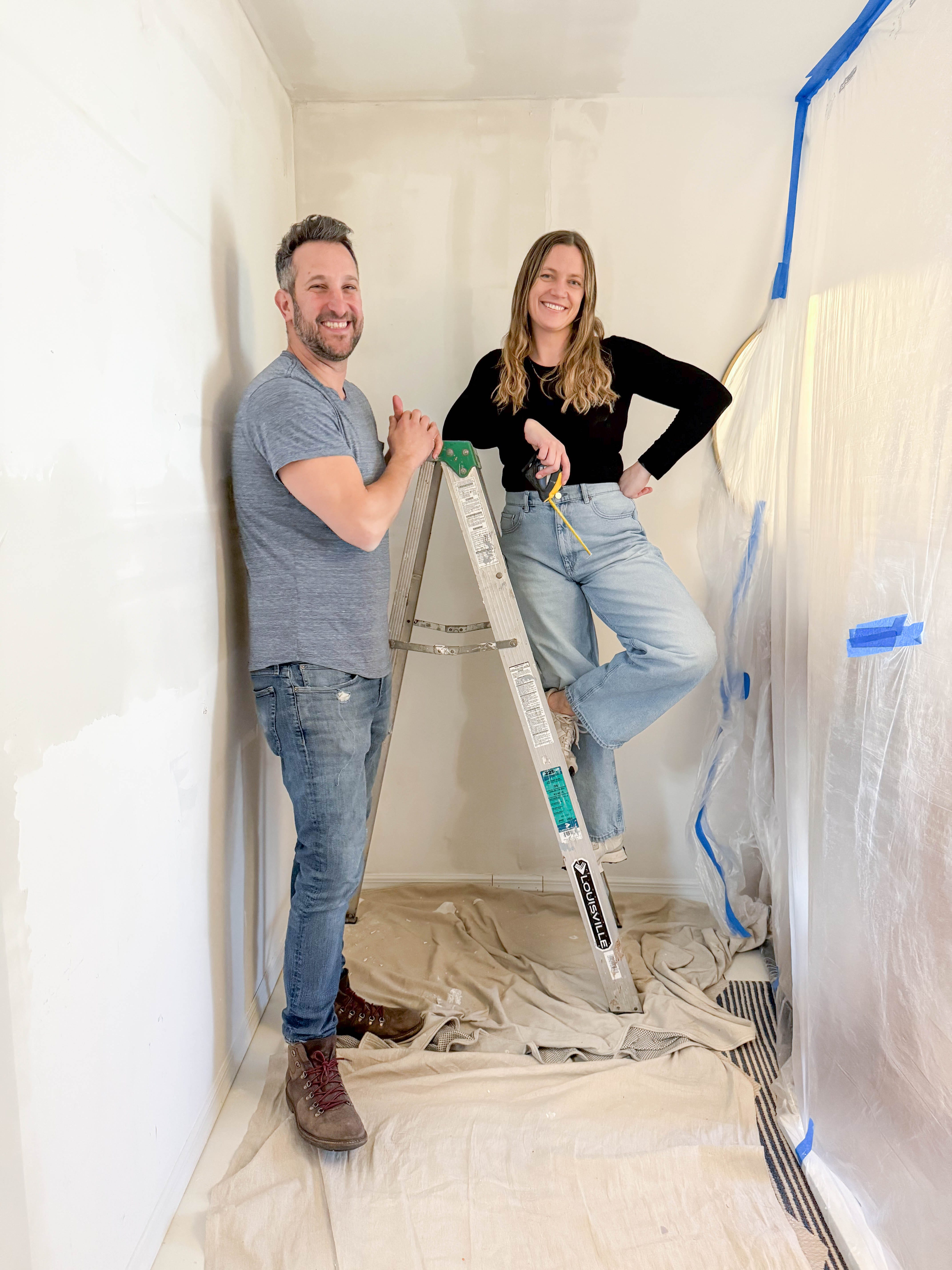 Cody and Blythe Graham-Jones pose on a ladder