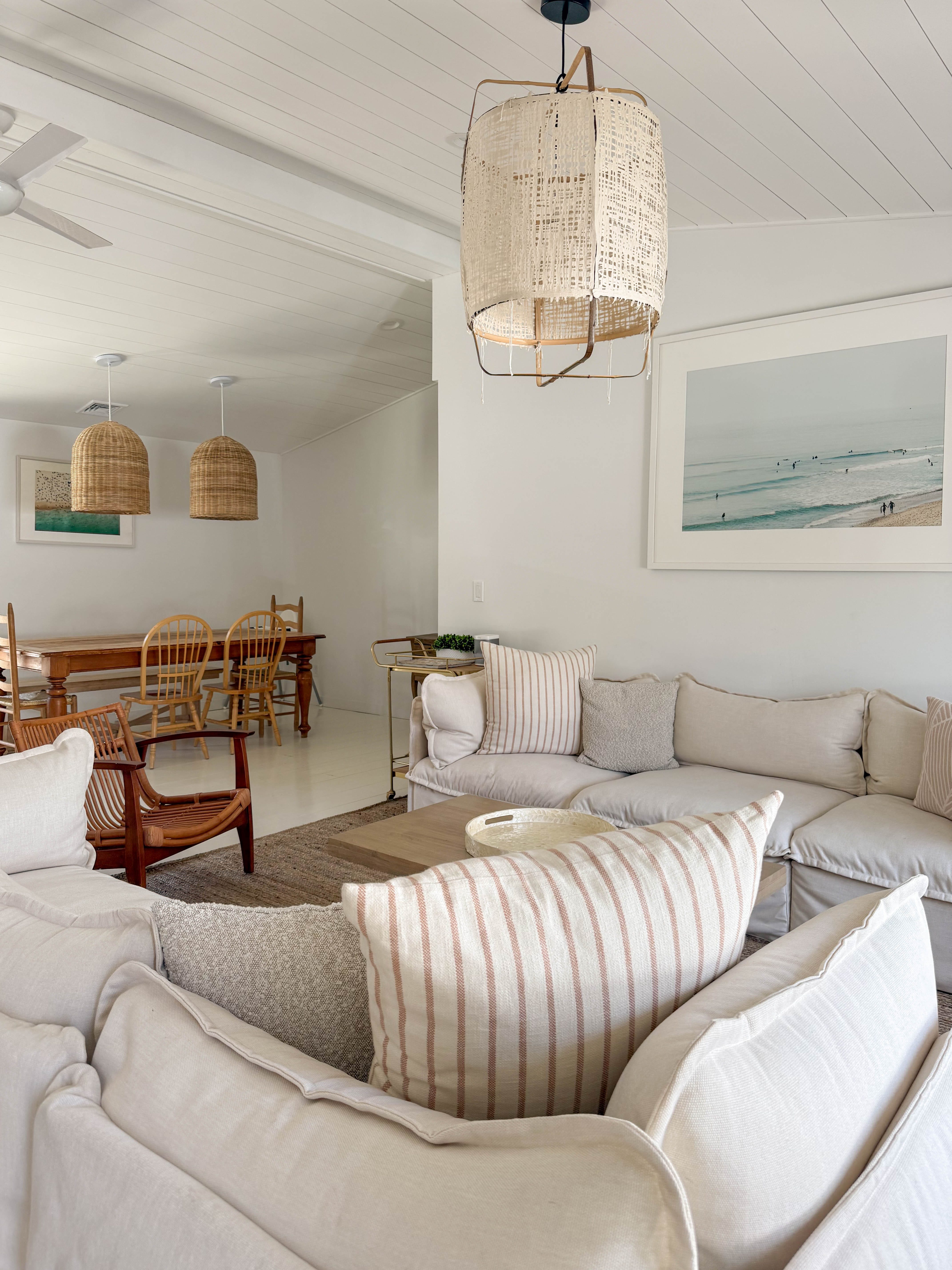 A modern beach home with white and beige furniture